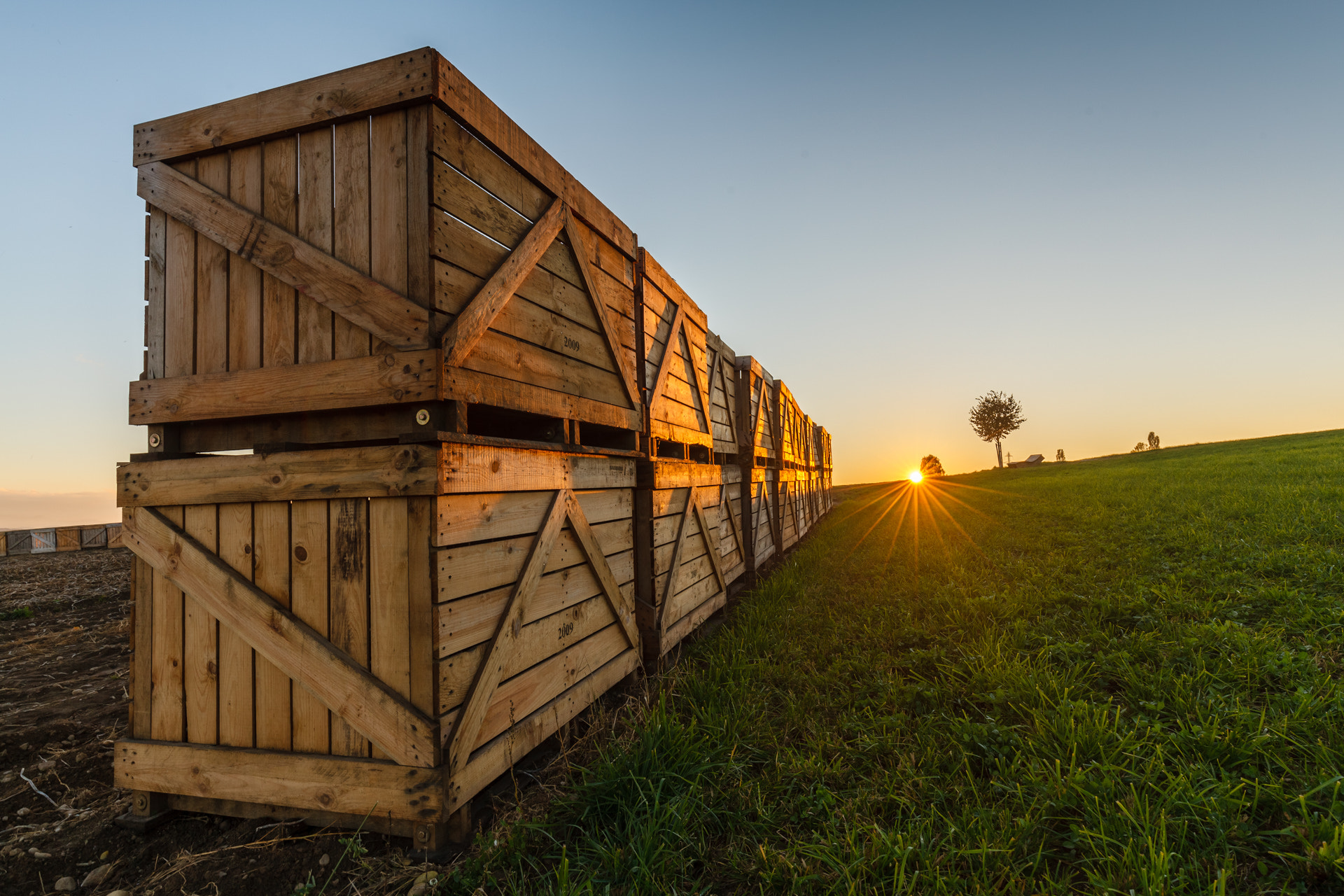 Canon EF 16-35mm F4L IS USM sample photo. Wooden boxes and sunset photography