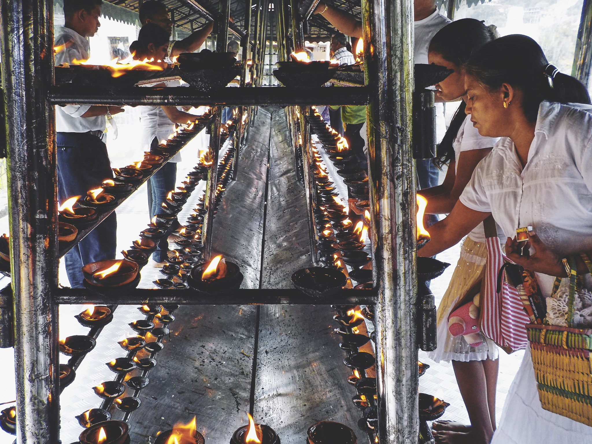 Nikon Coolpix S32 sample photo. Praying near the temple of sacred tooth relic photography