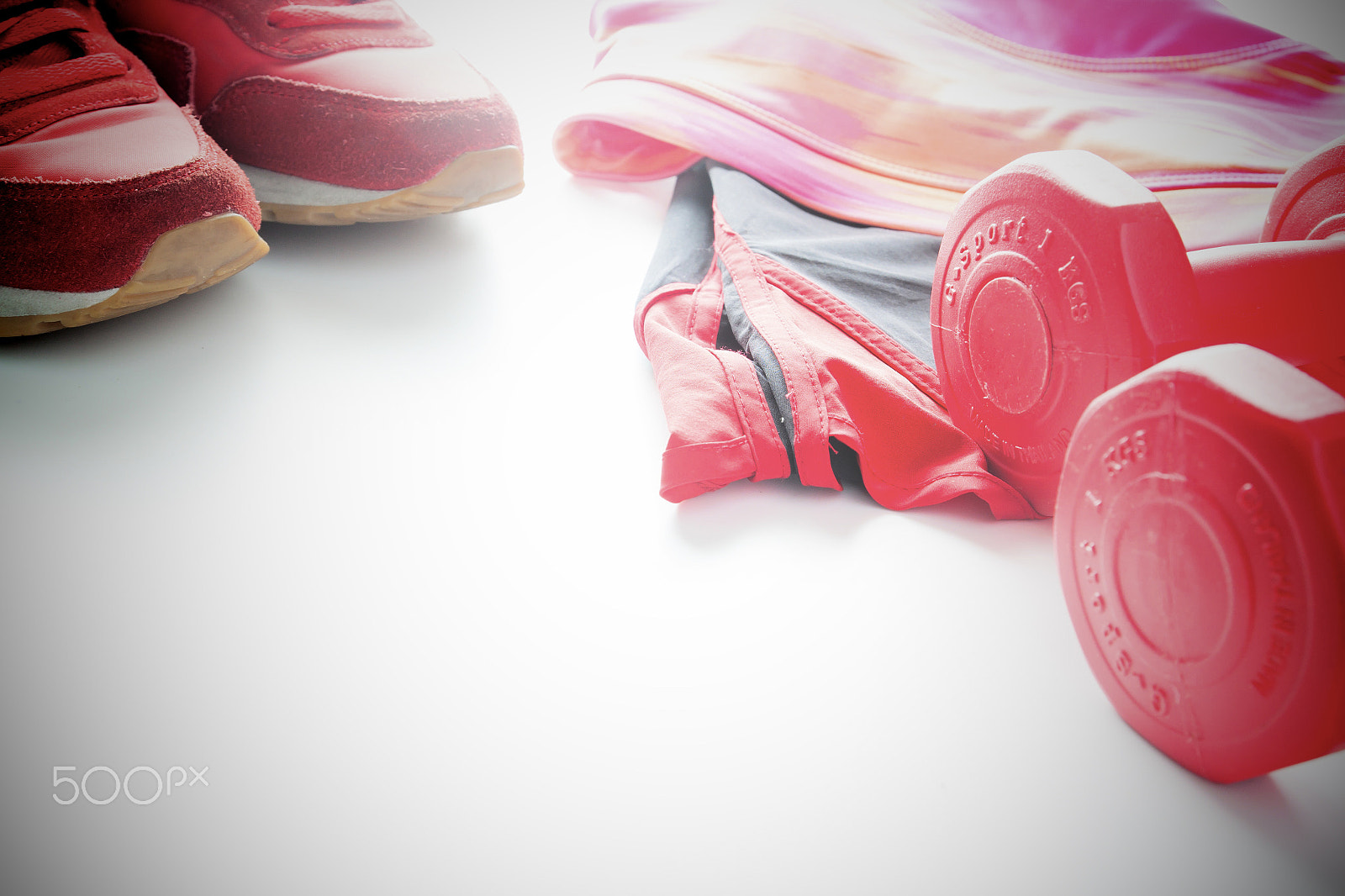 Canon EOS 500D (EOS Rebel T1i / EOS Kiss X3) sample photo. Red dumbbells and sport wear in fittness background. sport wear, photography