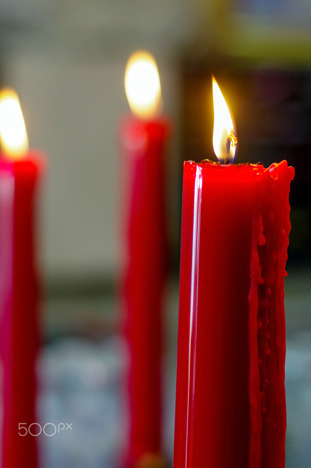 Pentax K-3 sample photo. Many red burning, long candles in budist temple photography