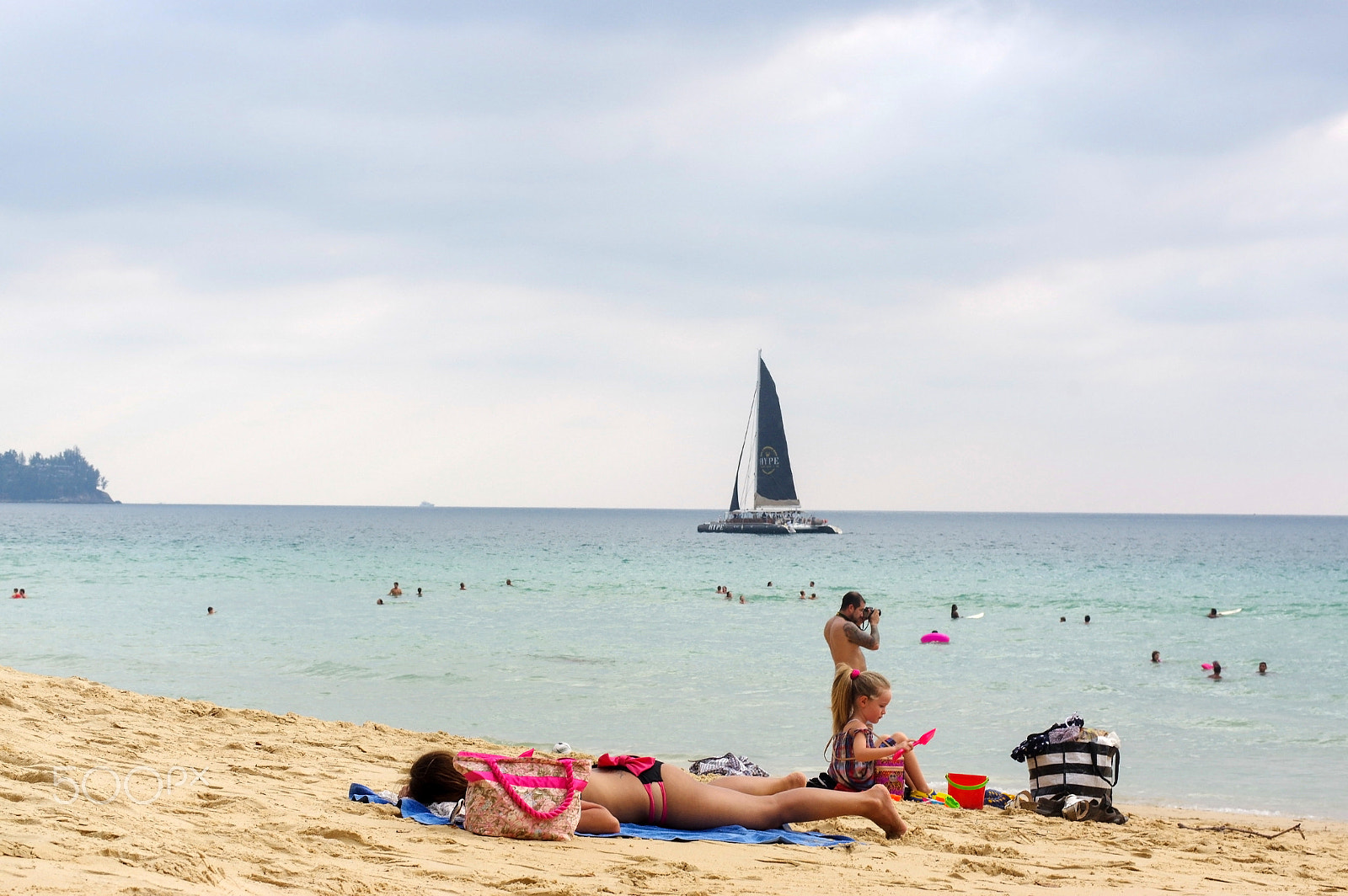 Pentax K-3 sample photo. Man with wife and children enjoy sunbathe on white sand beach th photography