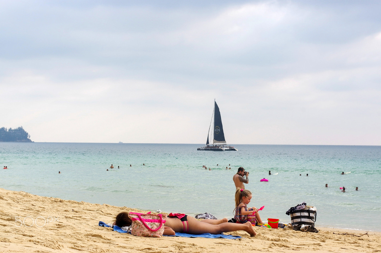 Pentax K-3 + Pentax smc DA* 55mm F1.4 SDM sample photo. Man with wife and children enjoy sunbathe on white sand beach th photography