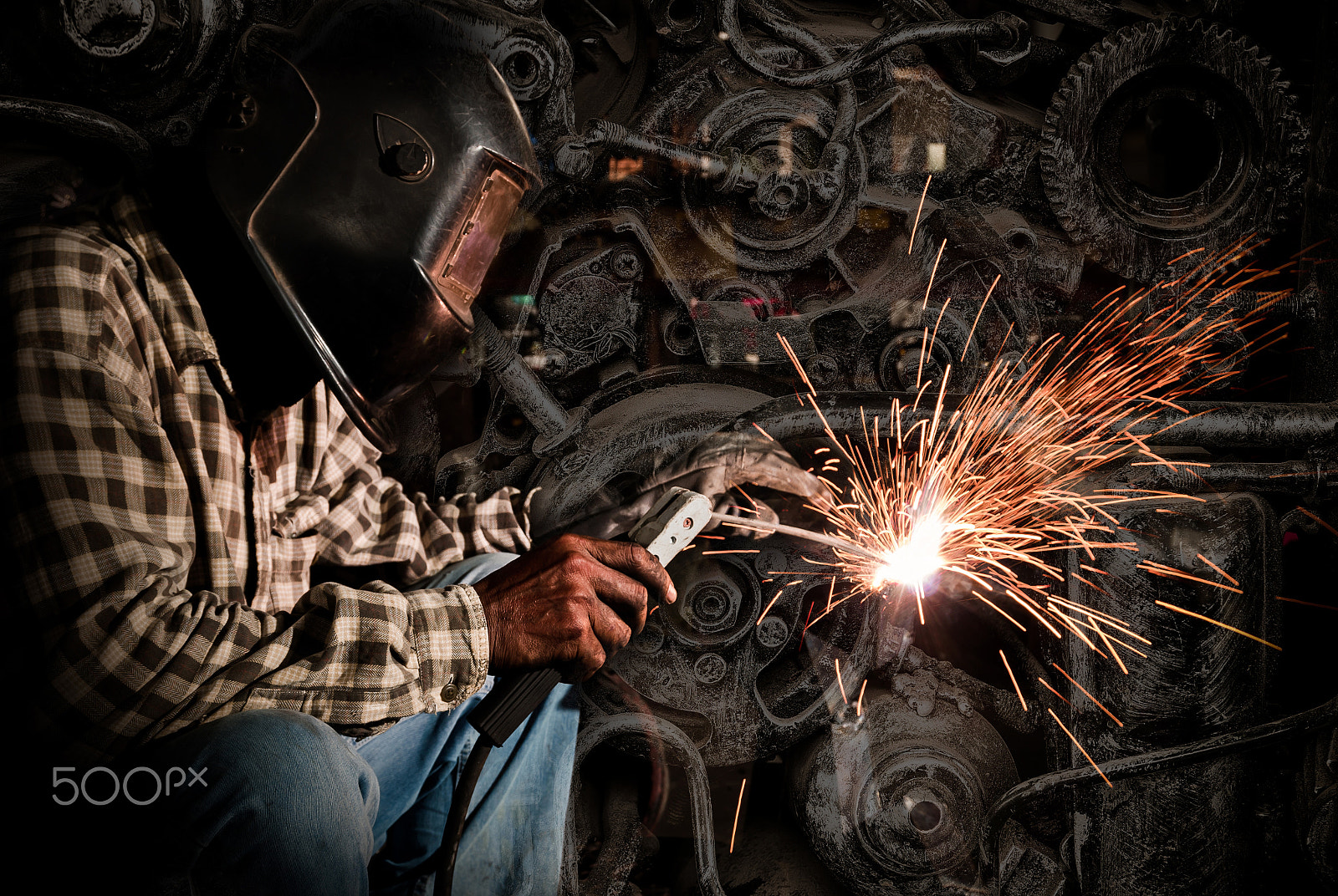 Pentax K-5 IIs sample photo. Welder at work with old machine steel background, industry conce photography