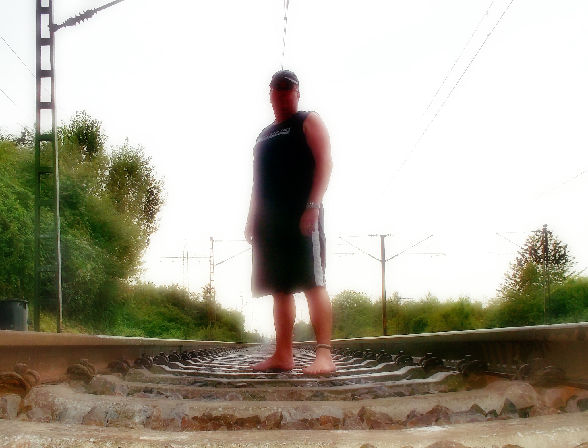 Samsung ST30 sample photo. Barefoot man on the railway photography