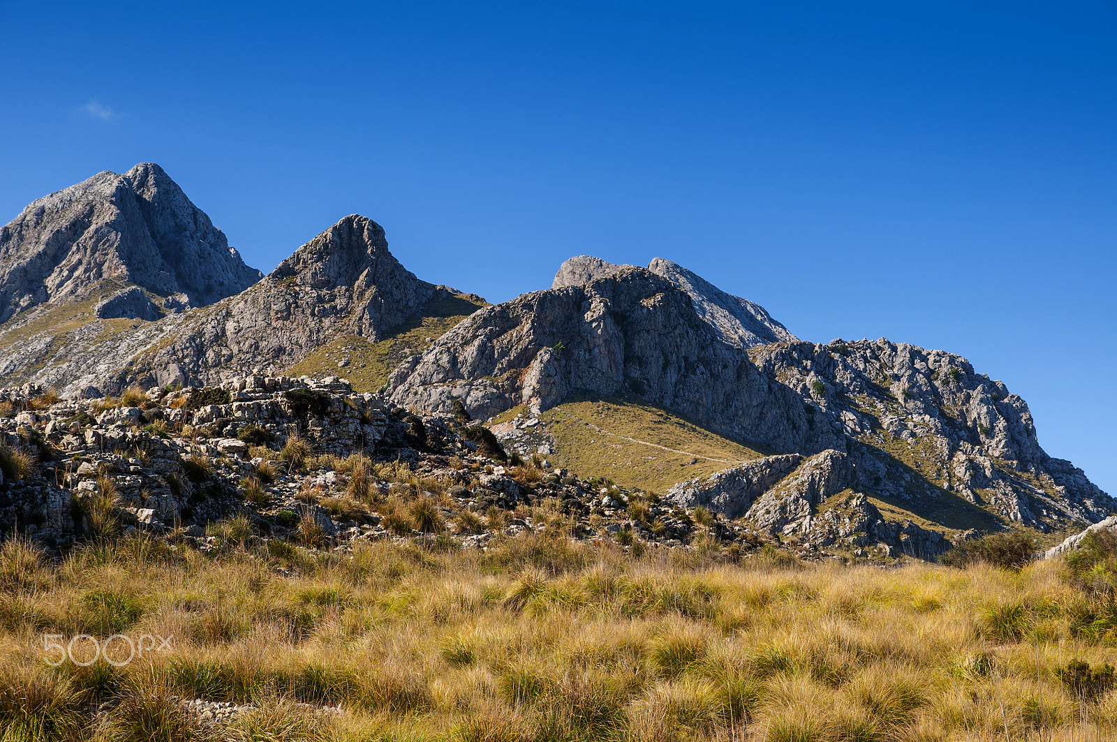 Sigma 17-70mm F2.8-4 DC Macro OS HSM sample photo. Majestic rocky mountains in sunlight photography