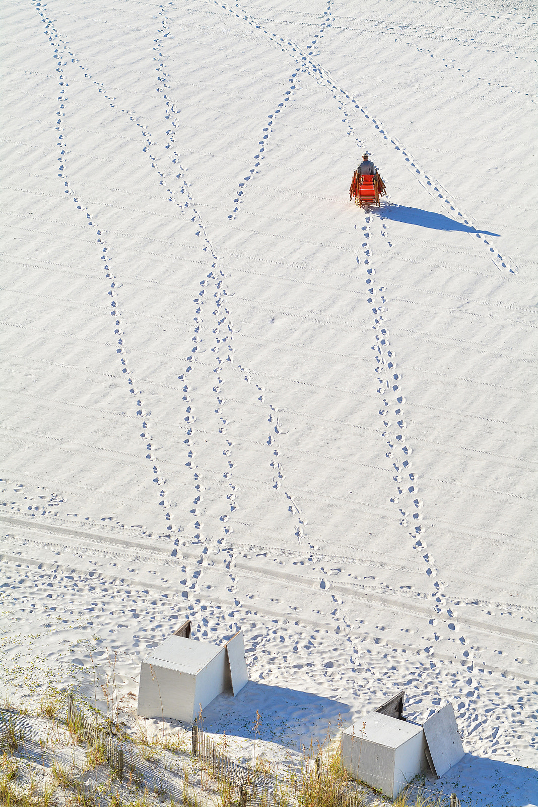 Nikon D7100 + AF Nikkor 85mm f/1.8 sample photo. Man carrying many beach chairs photography