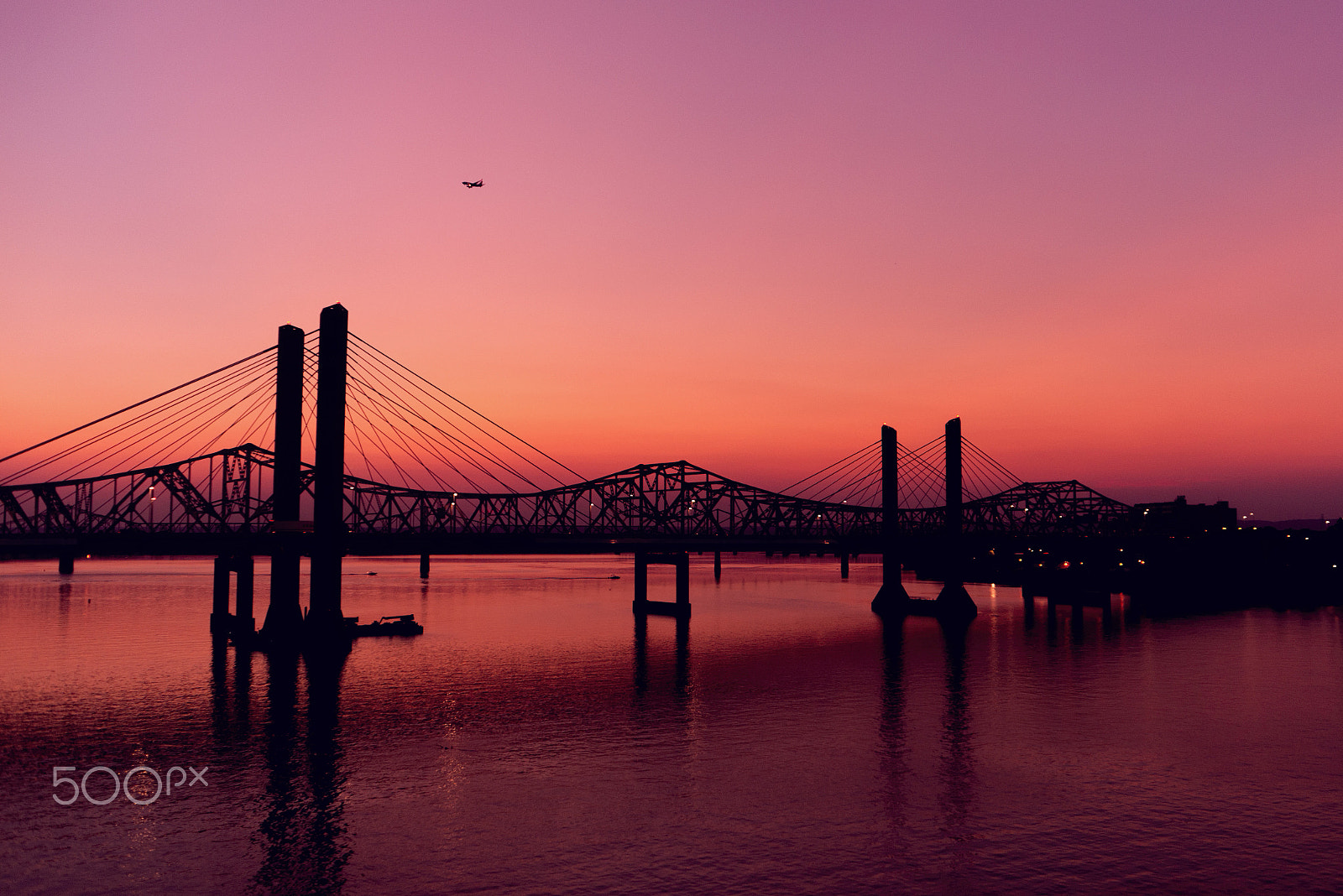 AF Zoom-Nikkor 28-85mm f/3.5-4.5 sample photo. Silhouette of bridge and a tiny flight on a beautiful sunset photography