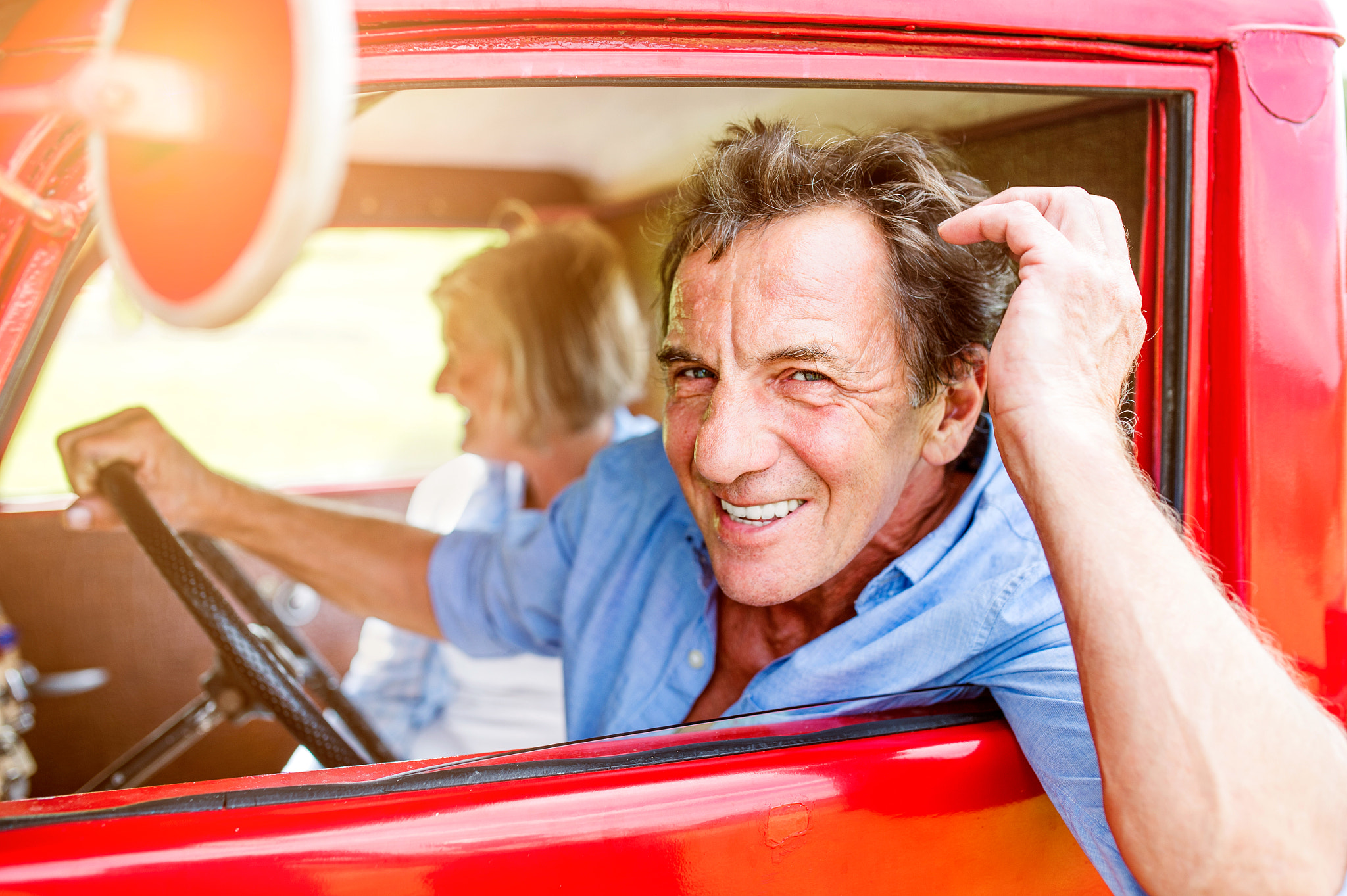 Nikon D4S + Sigma 35mm F1.4 DG HSM Art sample photo. Close up of senior couple inside a pickup truck photography