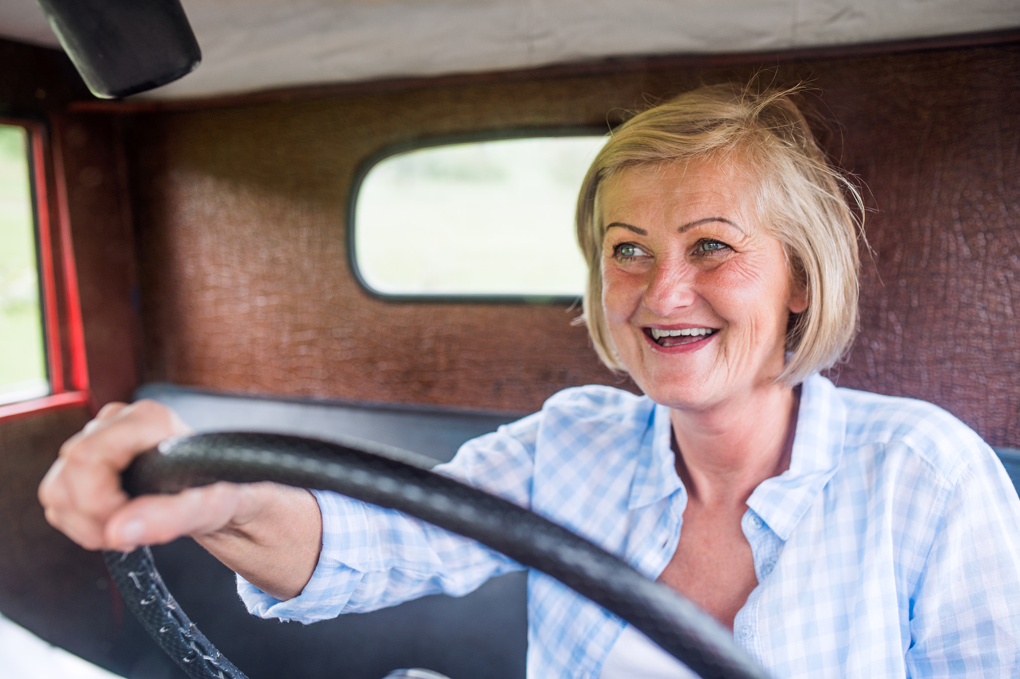 Nikon D4S + Sigma 35mm F1.4 DG HSM Art sample photo. Close up of senior woman inside vintage pickup truck photography