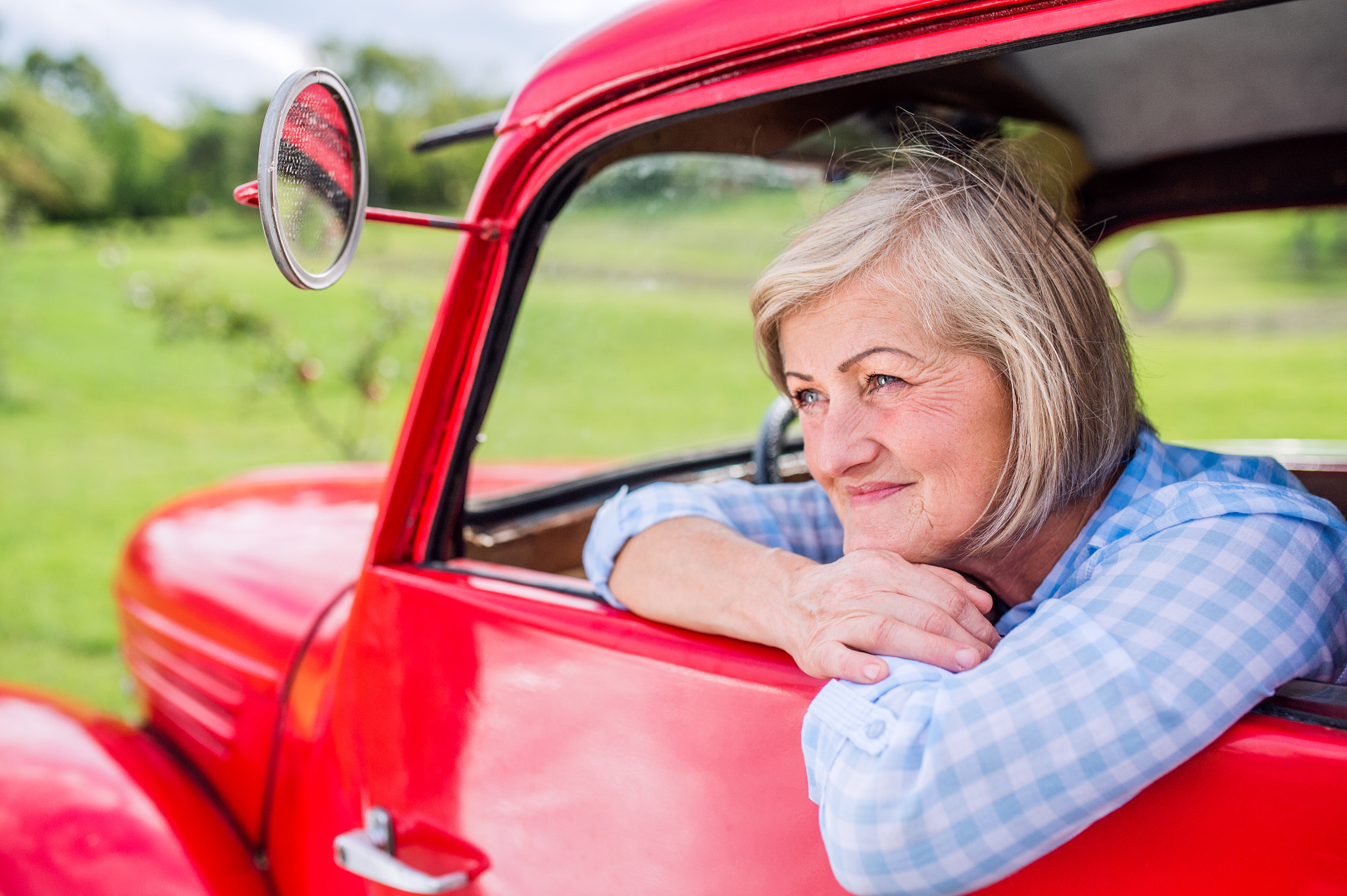 Nikon D4S + Sigma 35mm F1.4 DG HSM Art sample photo. Close up of senior woman inside vintage pickup truck photography