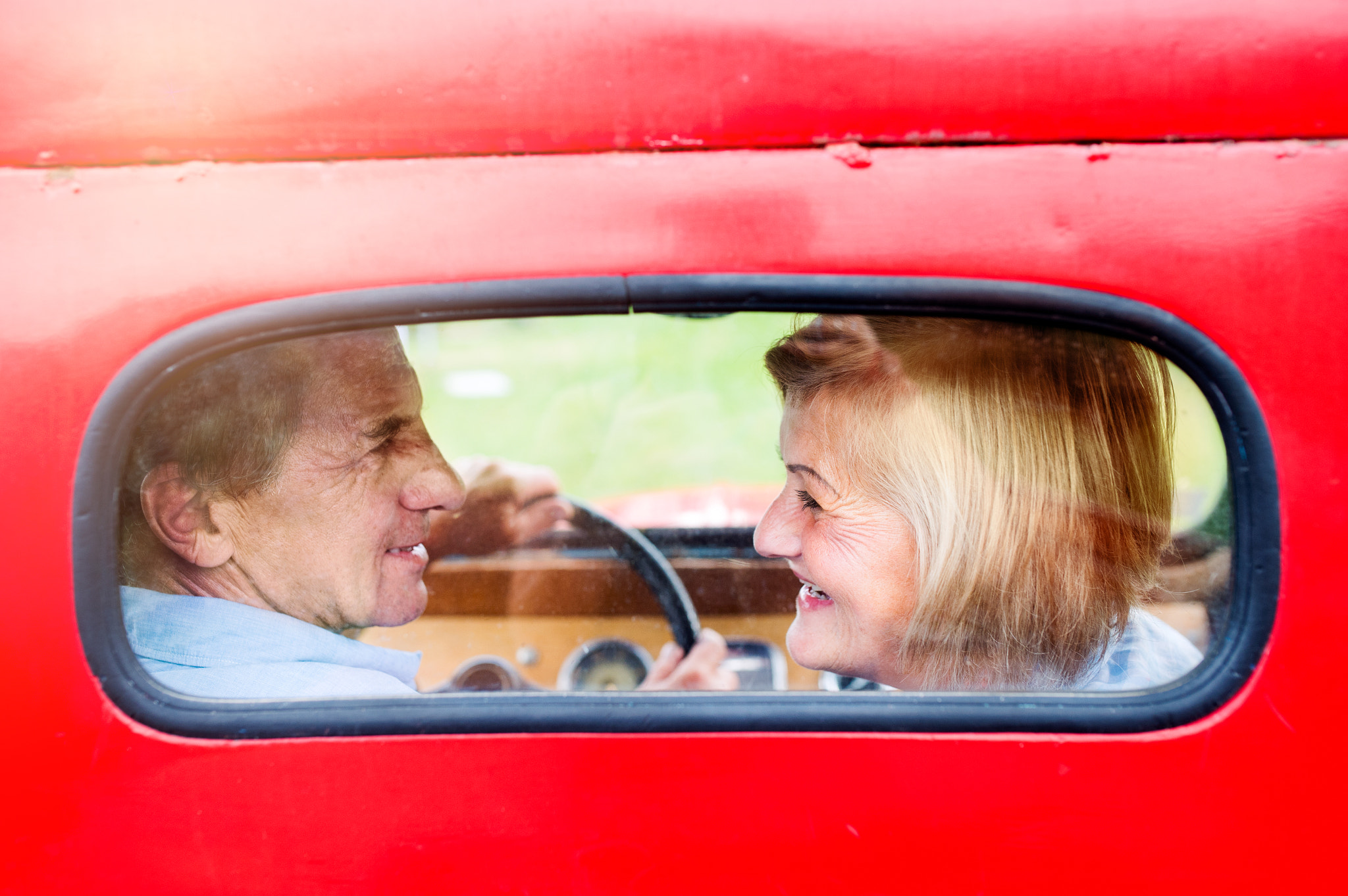 Nikon D4S + Sigma 35mm F1.4 DG HSM Art sample photo. Close up of senior couple inside a pickup truck photography