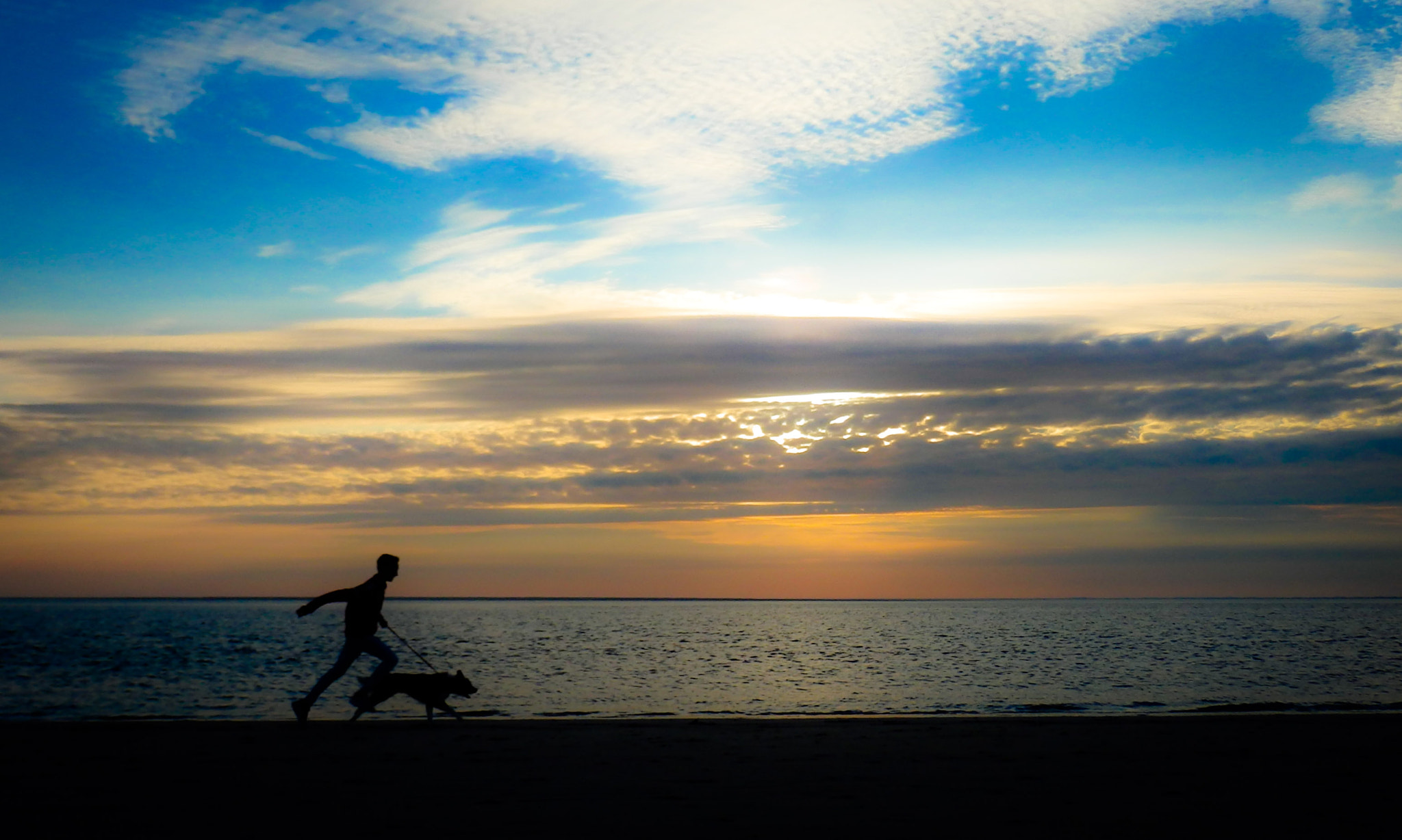 Olympus SZ-31MR sample photo. Running on the beach at sunset photography