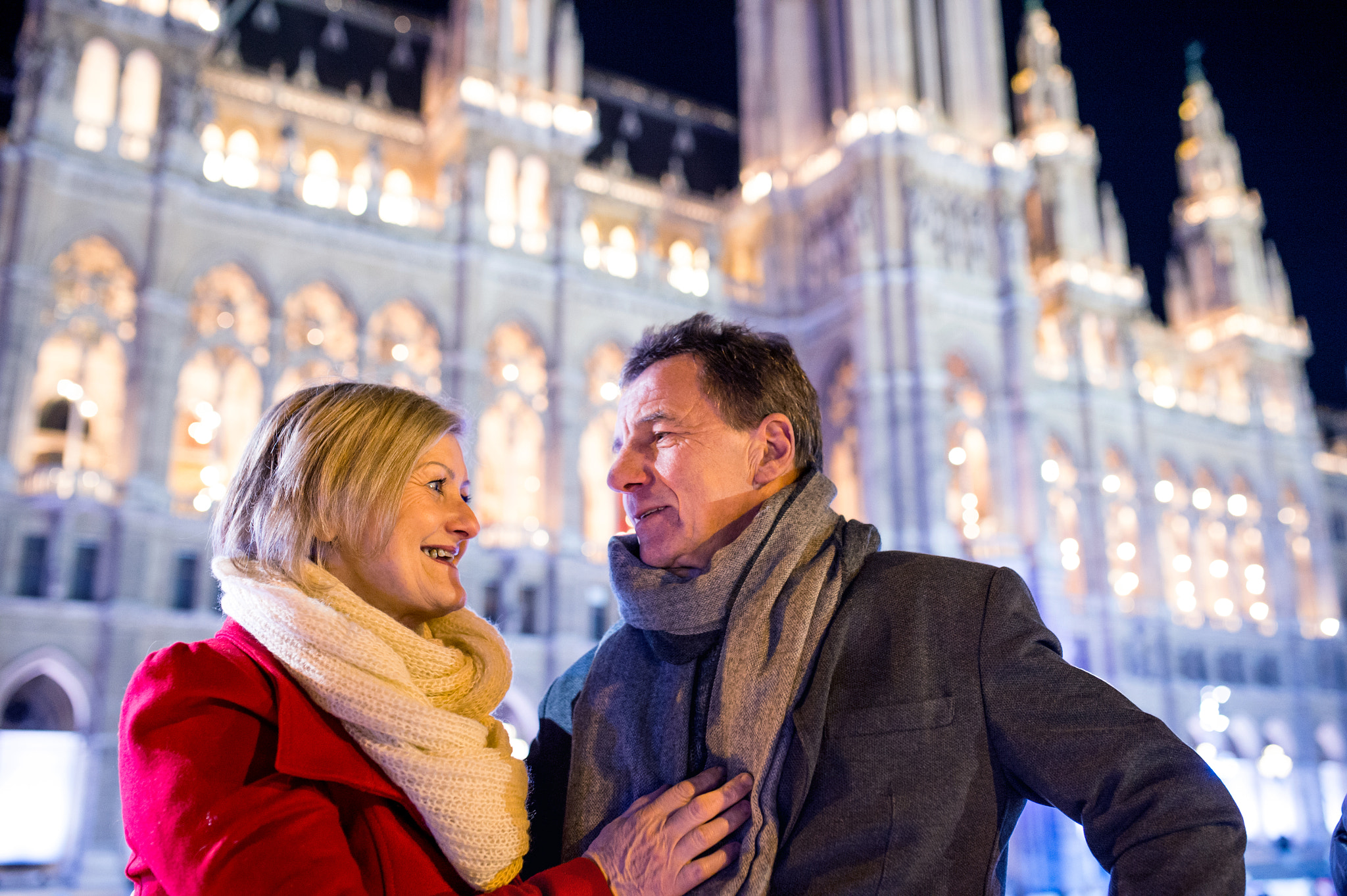 Nikon D4S + Sigma 35mm F1.4 DG HSM Art sample photo. Senior couple walking in night city. winter, historical building photography