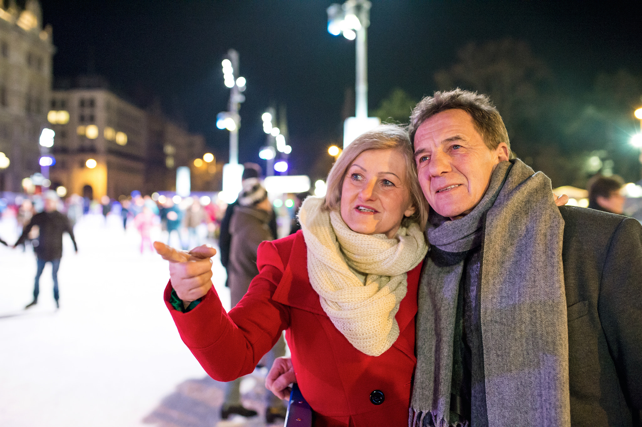 Nikon D4S + Sigma 35mm F1.4 DG HSM Art sample photo. Beautiful senior couple ice skating in city centre. winter photography