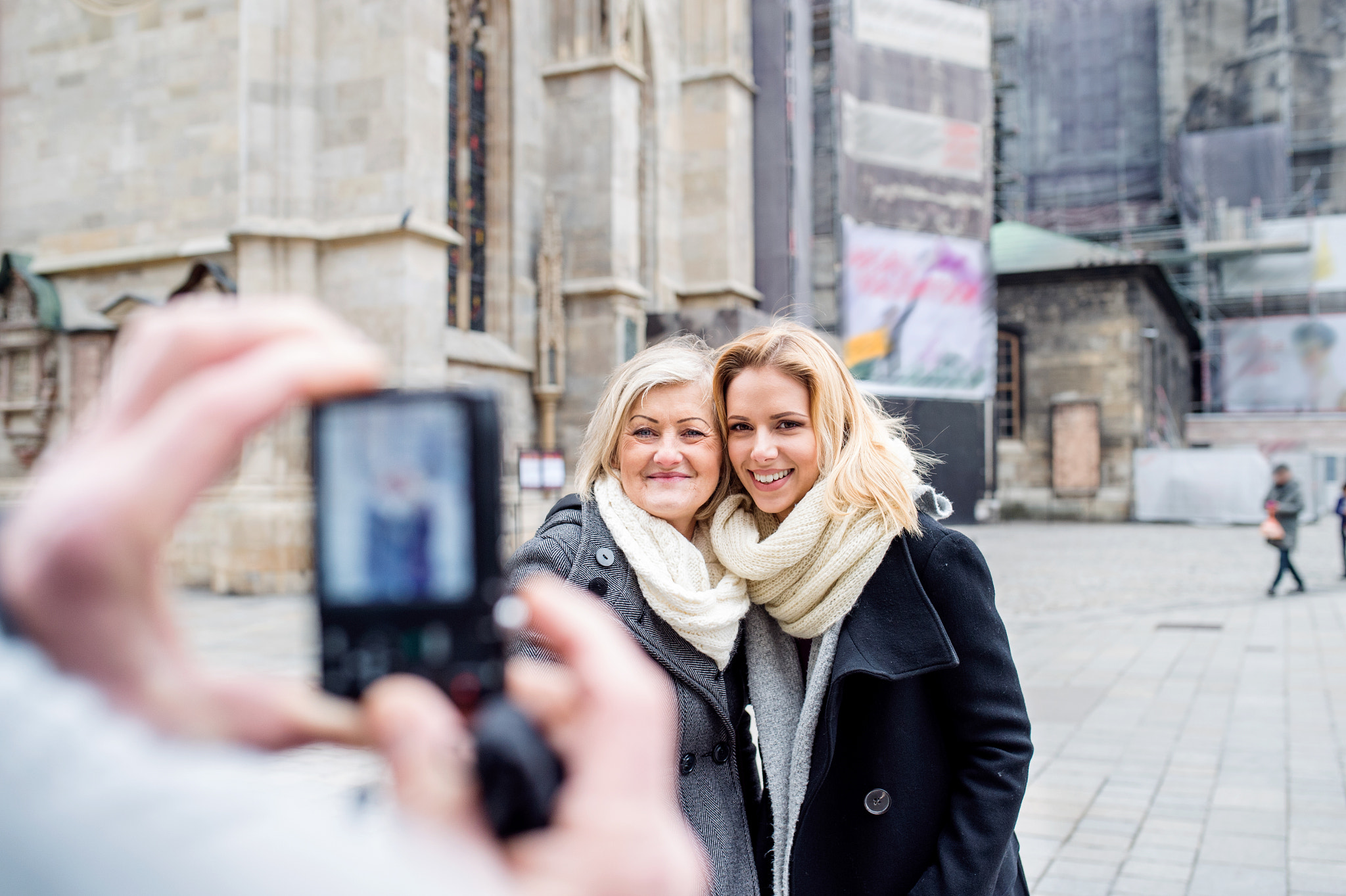 Nikon D4S + Sigma 35mm F1.4 DG HSM Art sample photo. Women posing for pictures in centre of the city. winter photography