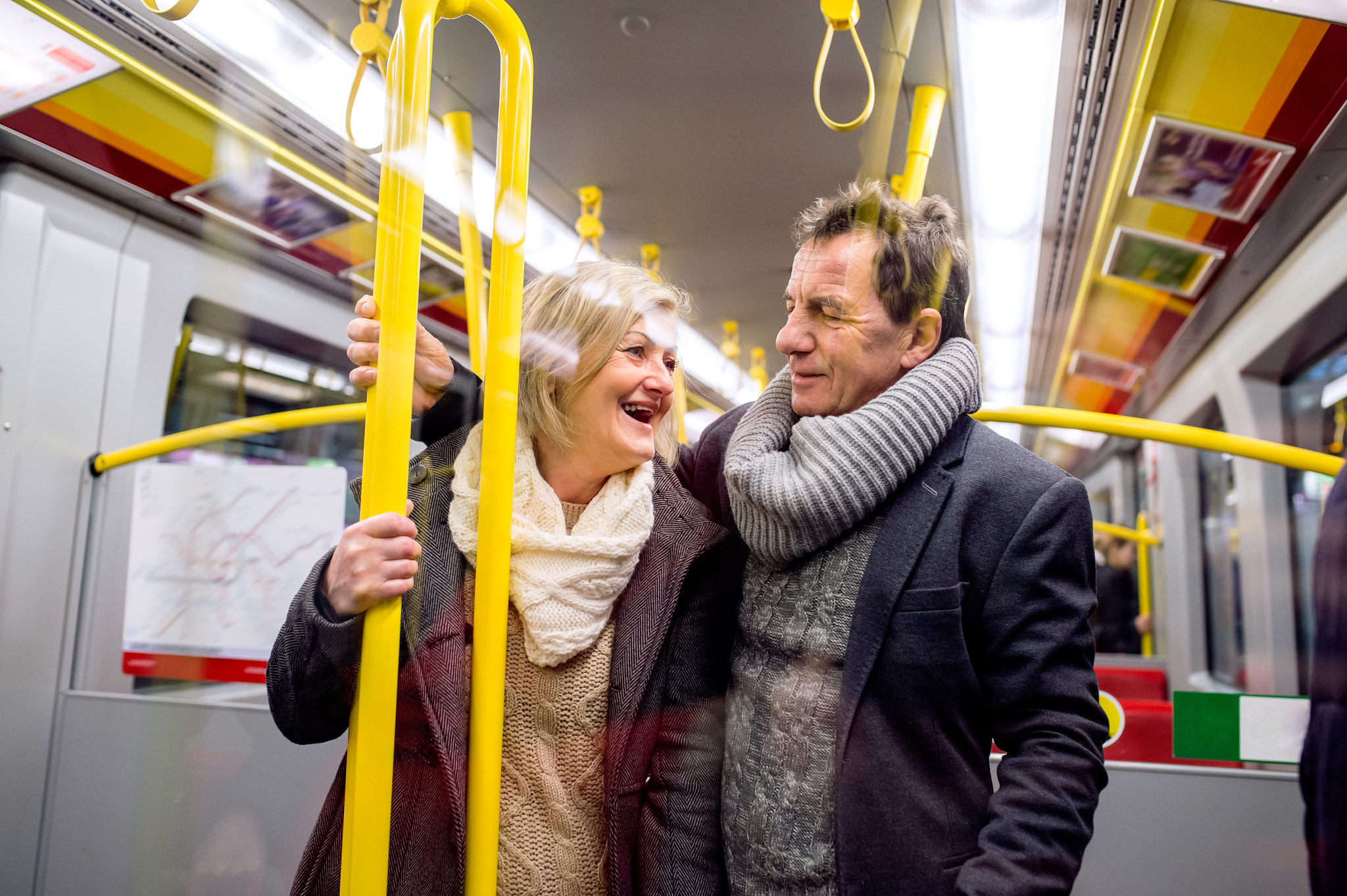 Nikon D4S + Sigma 35mm F1.4 DG HSM Art sample photo. Senior couple standing in a crowded subway train photography