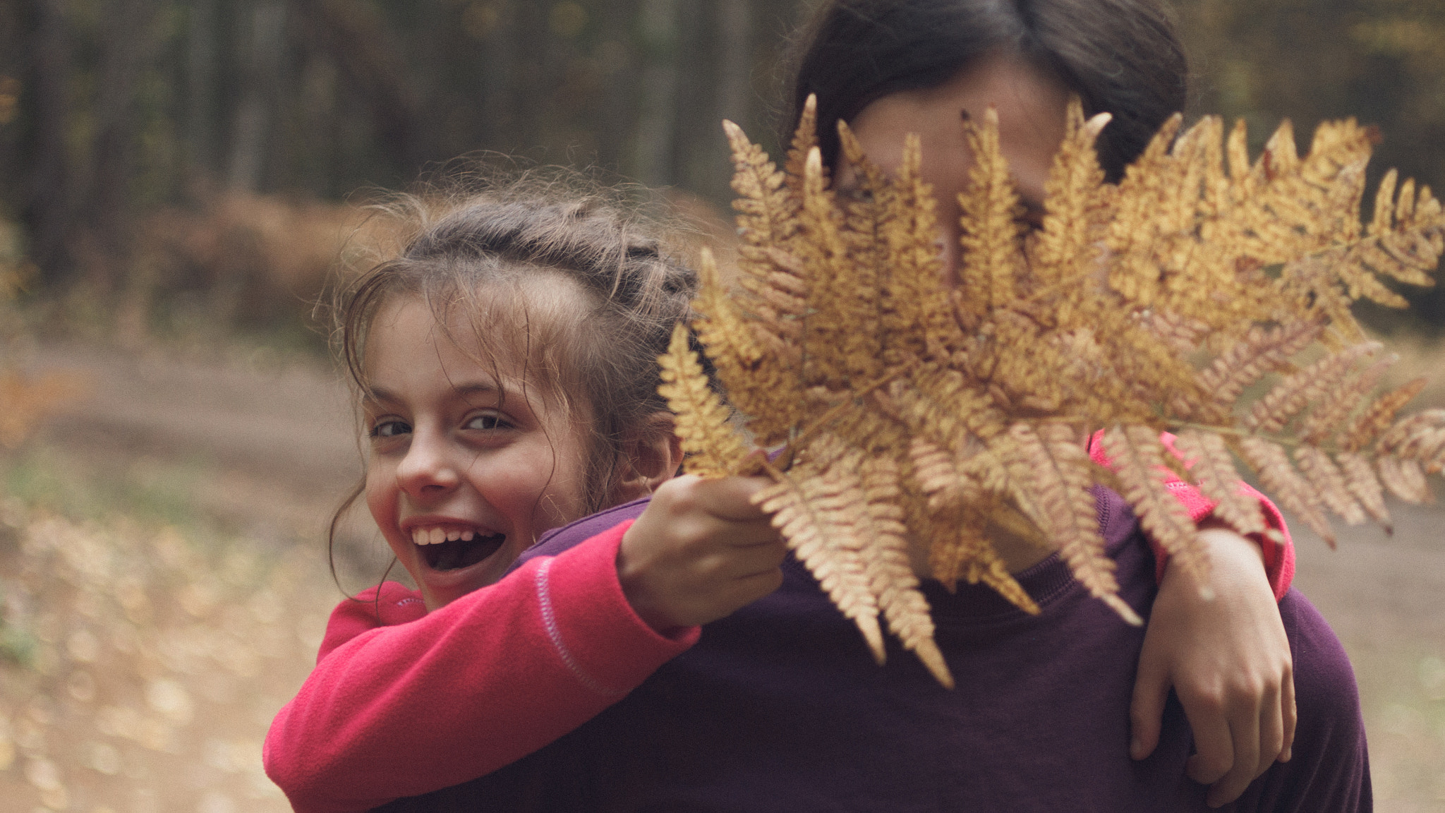Canon EF 50mm F2.5 Macro sample photo. Joyful little girl with her mother. photography