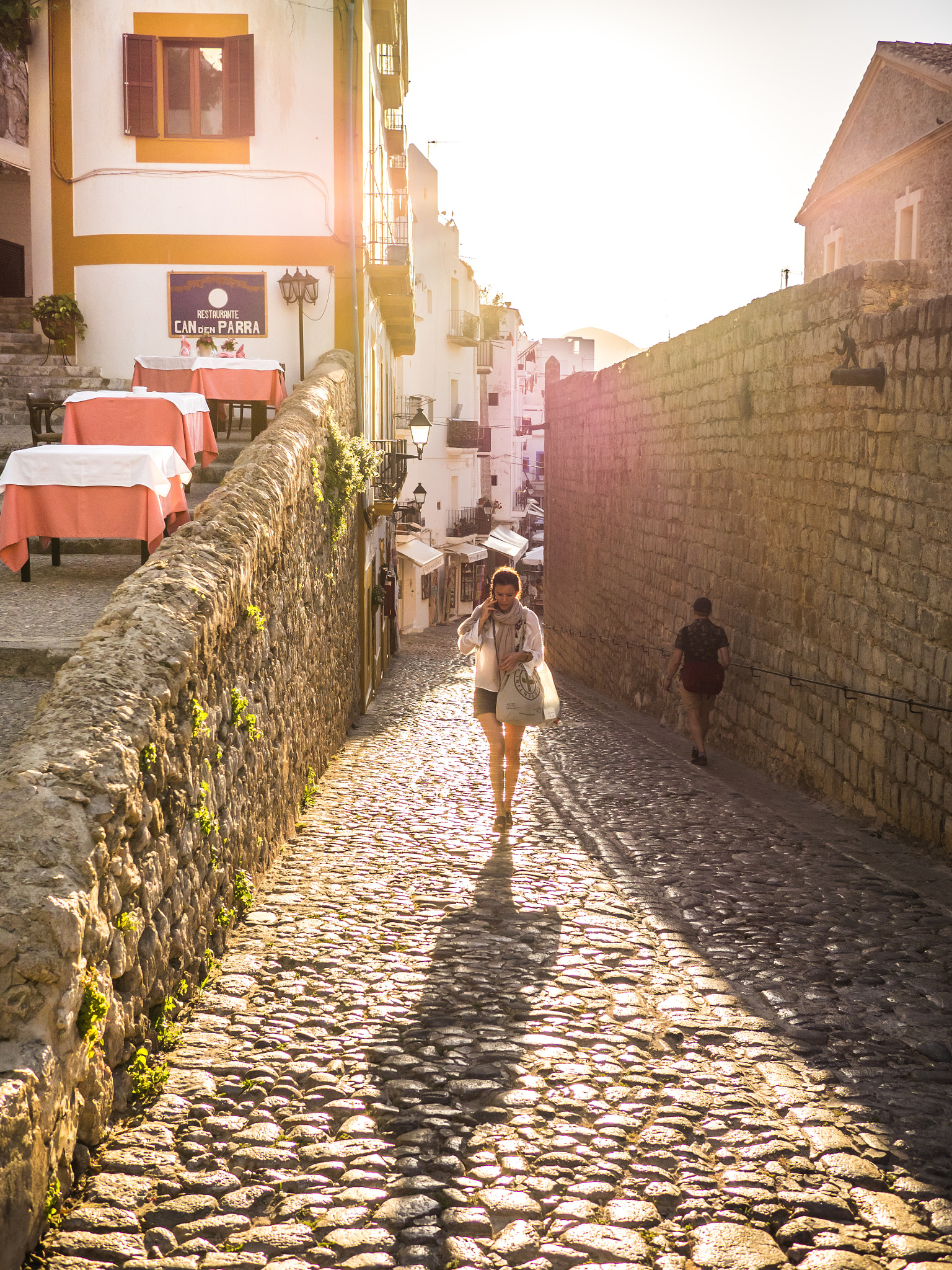 Olympus OM-D E-M1 + Panasonic Lumix G 20mm F1.7 ASPH sample photo. Walking by ibiza old town photography