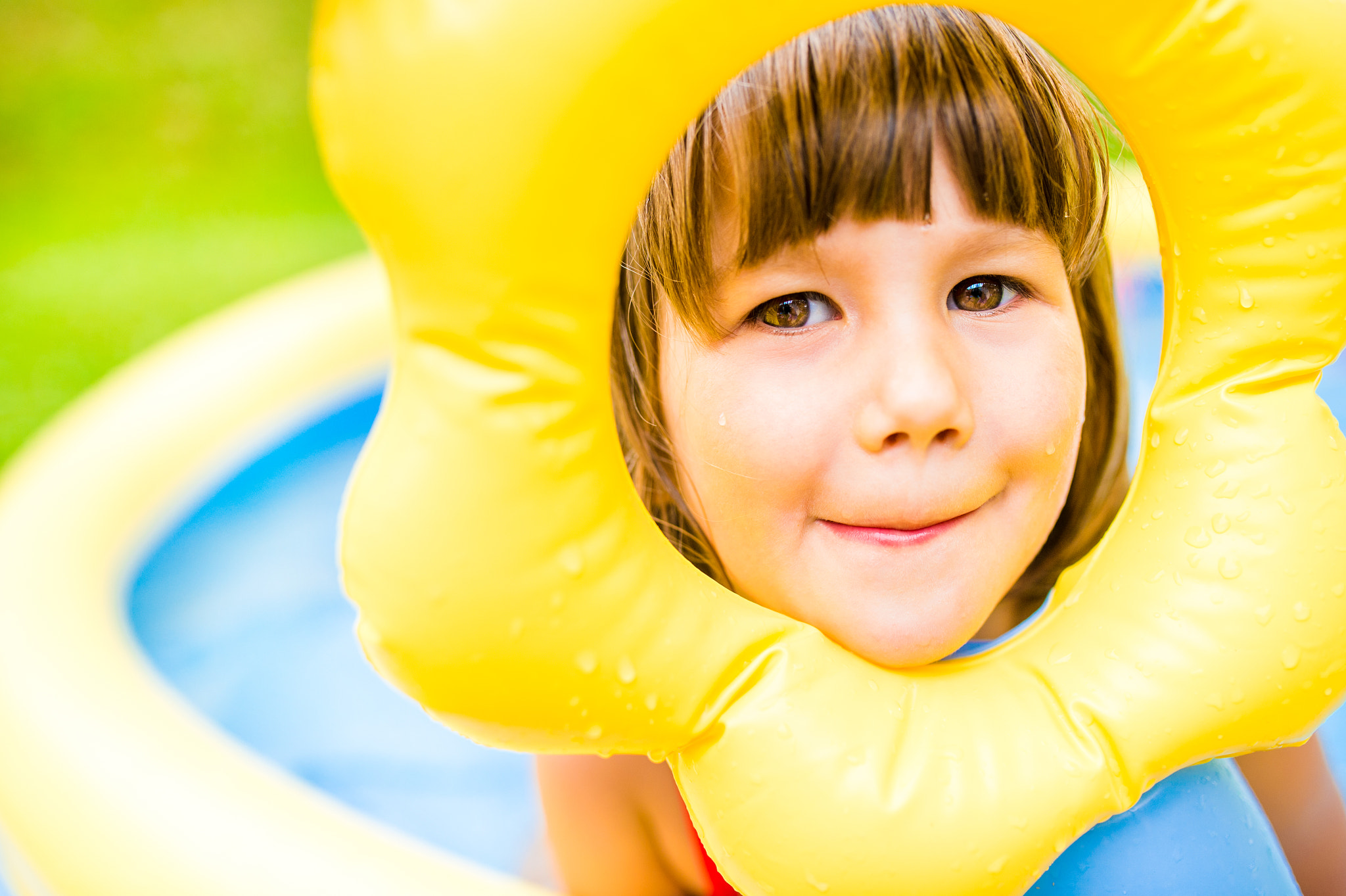 Nikon D4S + Sigma 35mm F1.4 DG HSM Art sample photo. Little girl having fun in the garden swimming pool. photography