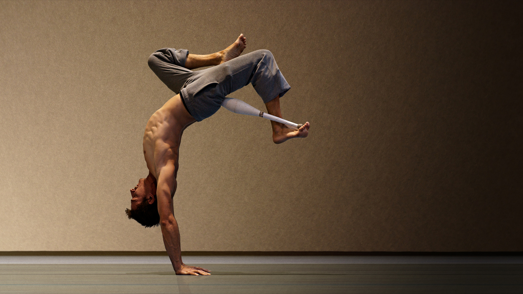 Sony Alpha DSLR-A700 + Sony 50mm F1.4 sample photo. Mexican handstand with a club photography