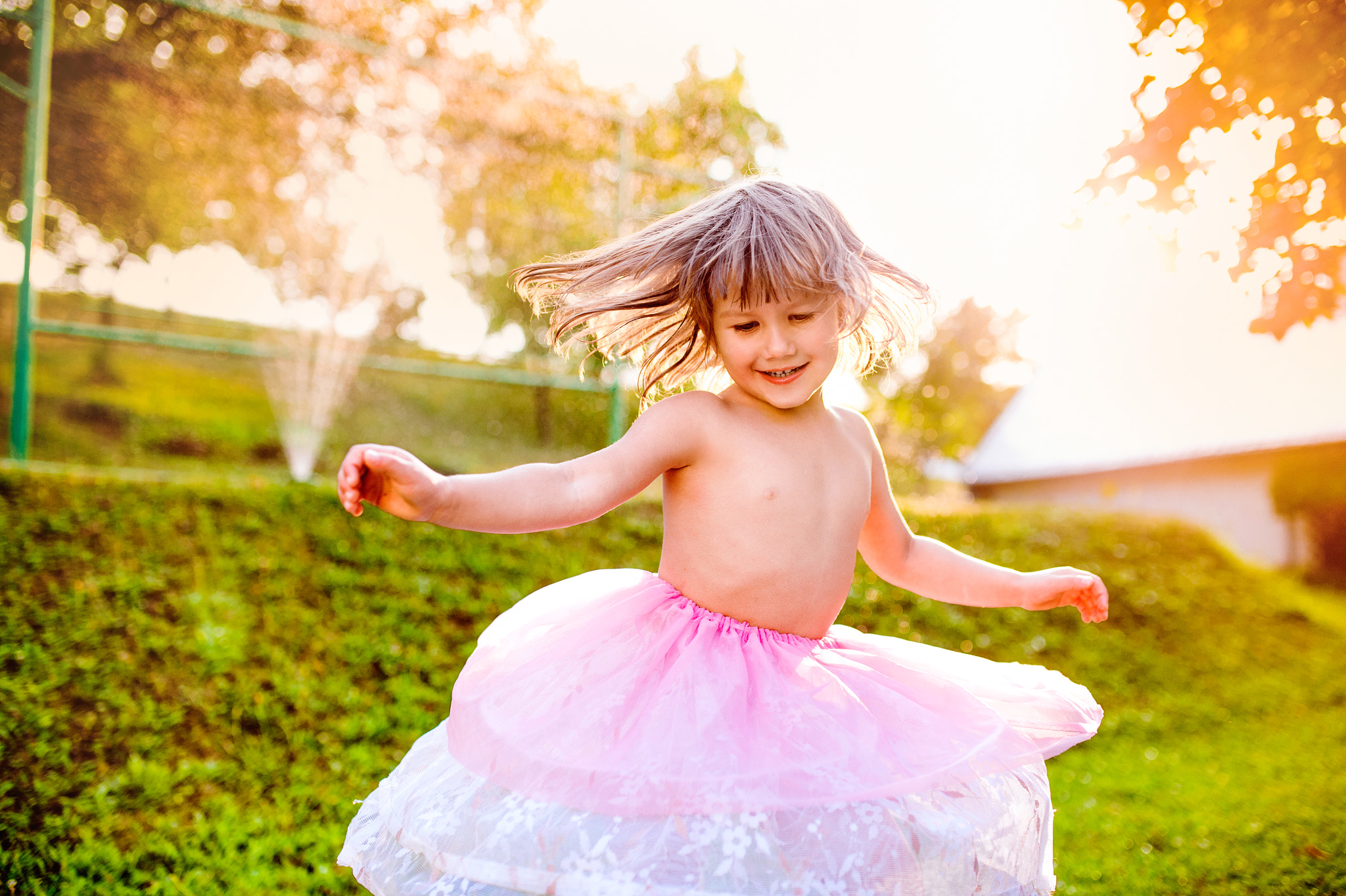 Nikon D4S + Sigma 35mm F1.4 DG HSM Art sample photo. Girl in princess skirt spinning in sunny summer garden photography