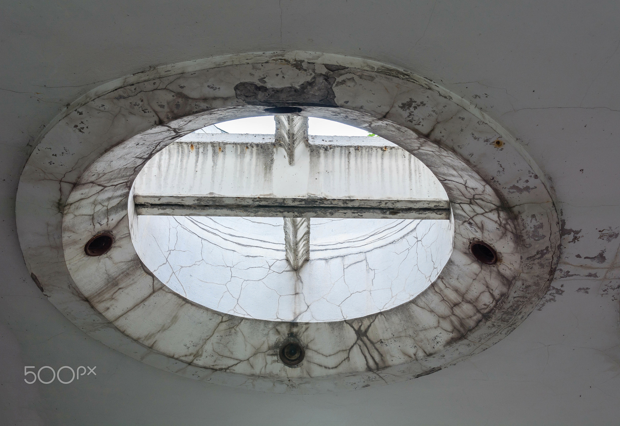 strange and futuristic concrete round shape design on the ceiling.