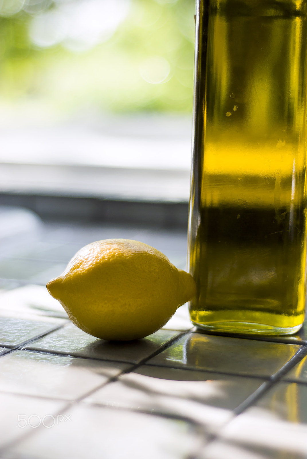 Nikon D60 + Nikon AF Nikkor 50mm F1.8D sample photo. Lemon and olive oil photography