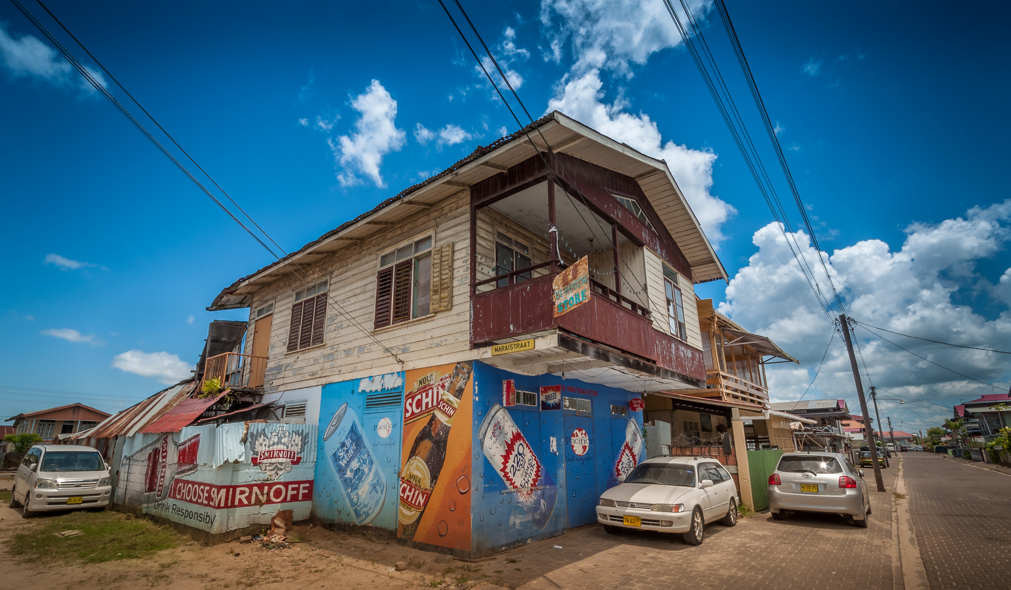 Samyang 14mm F2.8 ED AS IF UMC sample photo. Advertising paintings on a wooden house in paramaribo photography