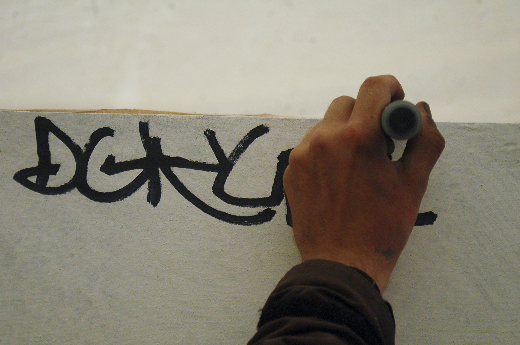AF Zoom-Nikkor 28-80mm f/3.3-5.6G sample photo. Graffiti drawing hands photography