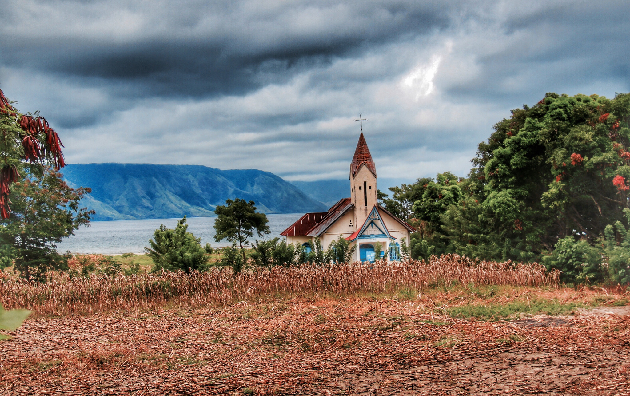 Canon EOS 7D + Canon EF-S 18-200mm F3.5-5.6 IS sample photo. Church on the shore lake toba sumatra photography