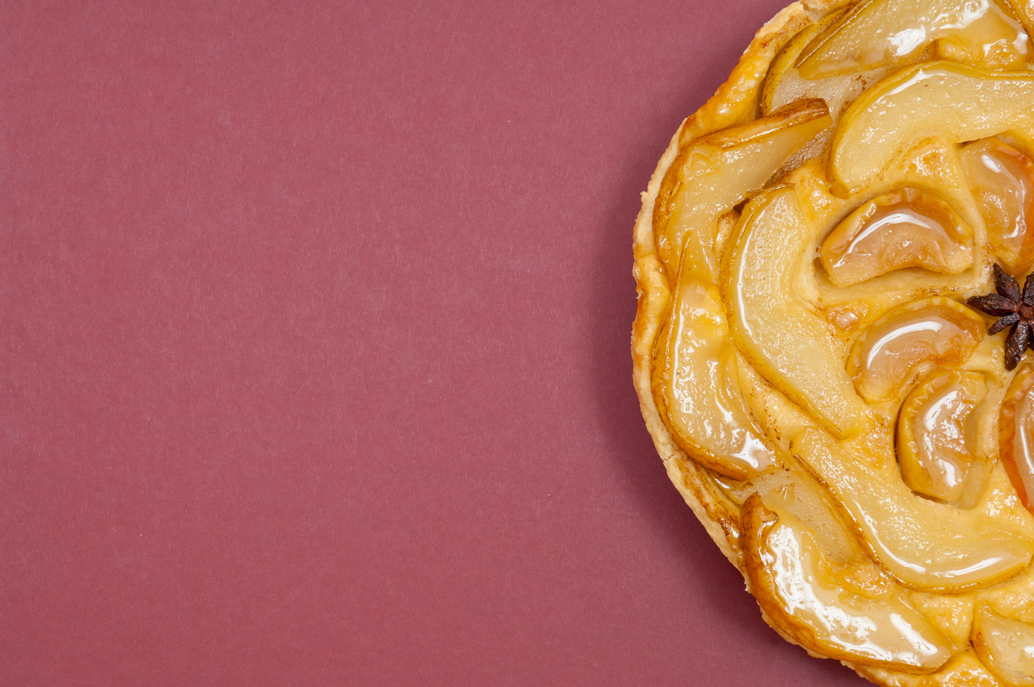 Nikon D2X sample photo. Tarte tatin apple pear tart isolated on claret background photography