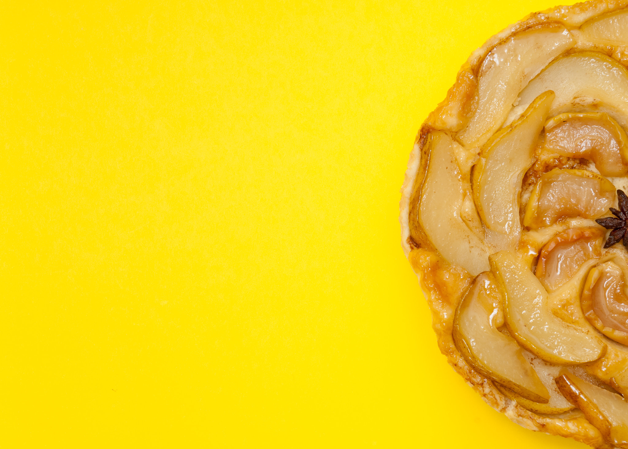 Nikon D2X sample photo. Tarte tatin apple pear tart isolated on yellow background photography