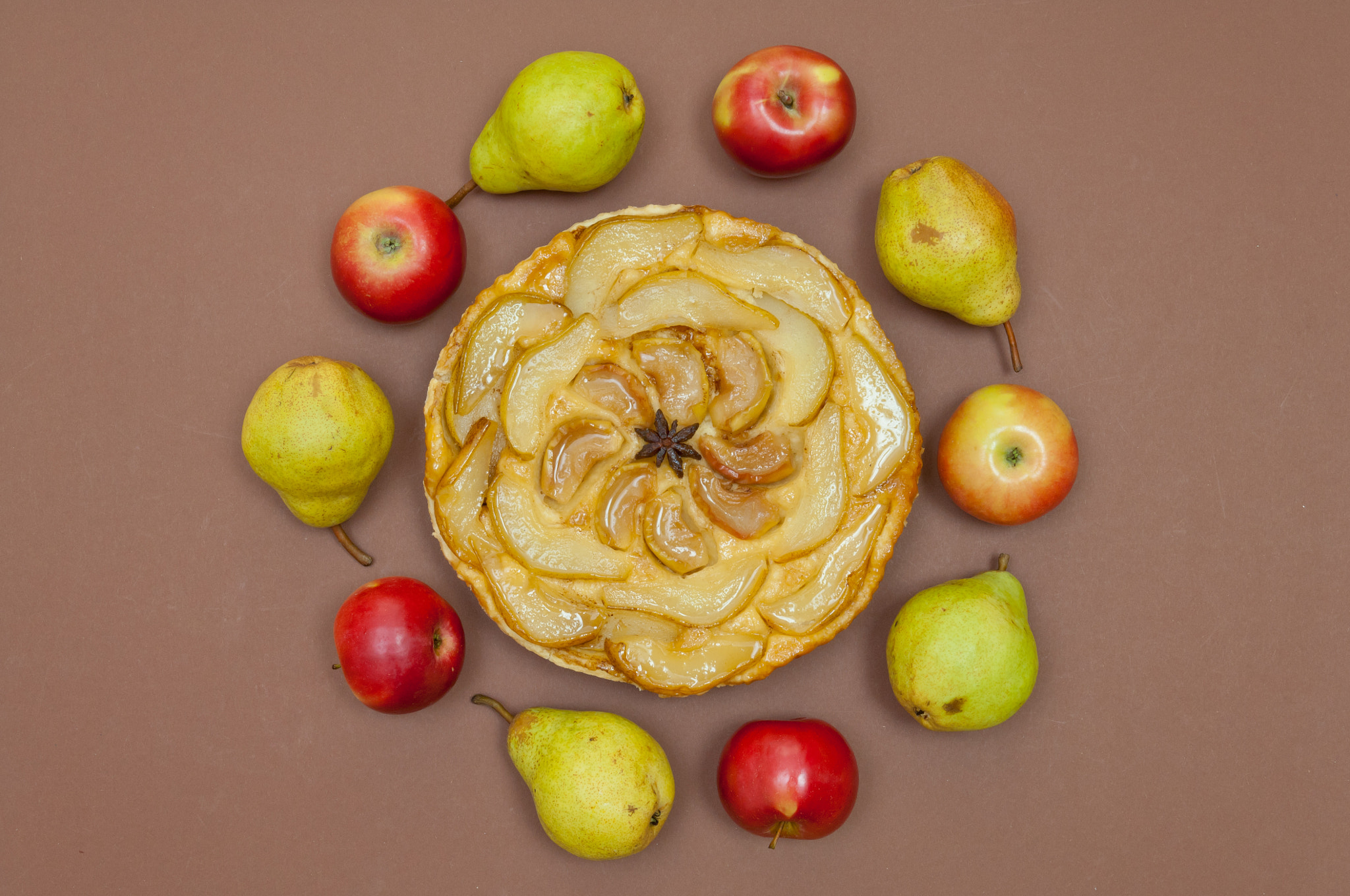 Nikon D2X sample photo. Tarte tatin apple pear tart with fruits on brown background photography