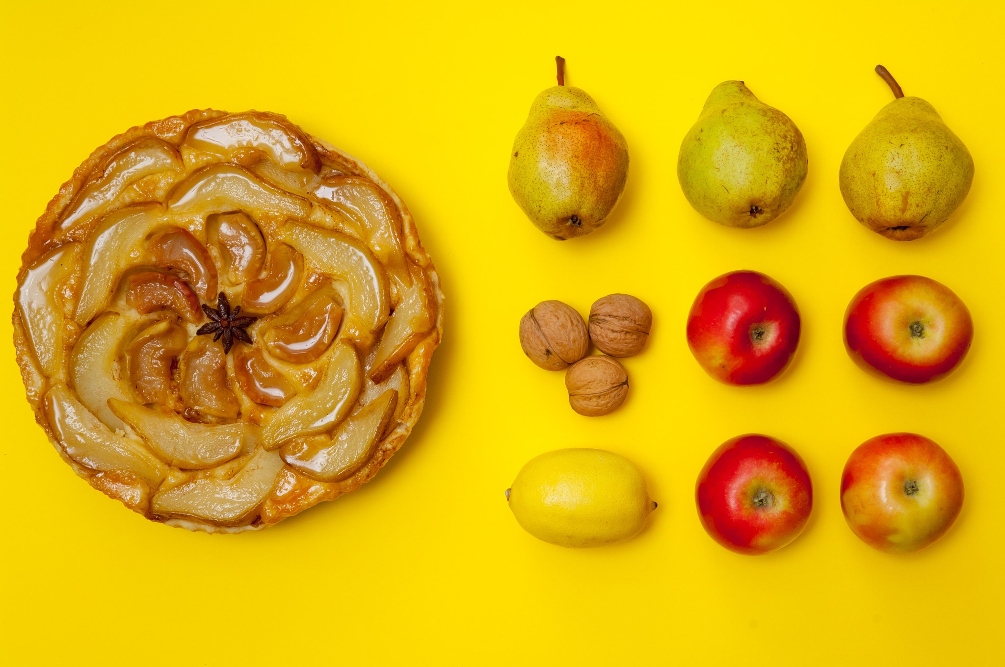 Nikon D2X sample photo. Whole tarte tatin apple tart with fruits on yellow background photography
