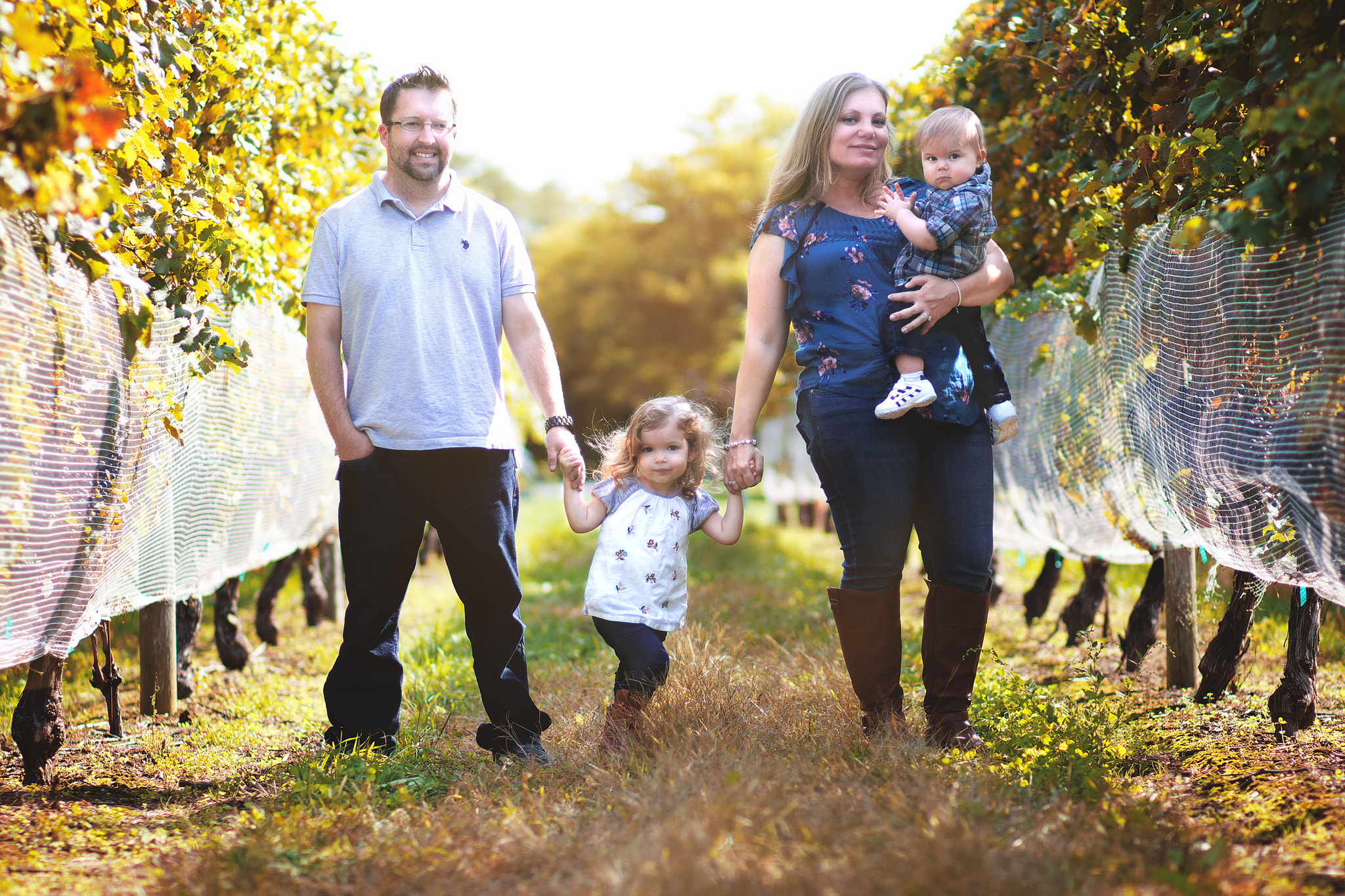 Canon EOS 100D (EOS Rebel SL1 / EOS Kiss X7) + Canon EF 85mm F1.8 USM sample photo. Family portrait in vineyards photography