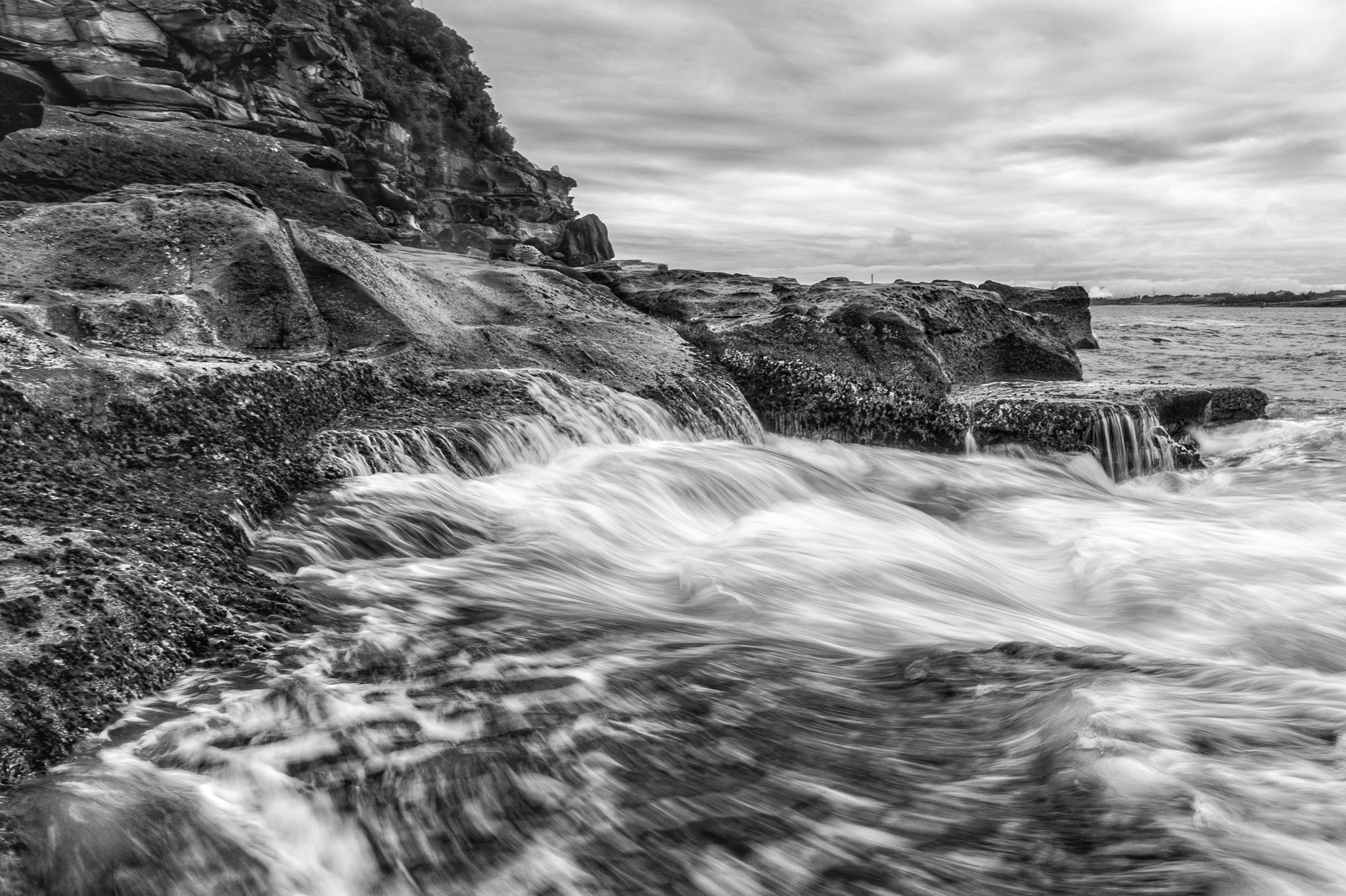 E 21mm F2.8 sample photo. Sea beaten photography