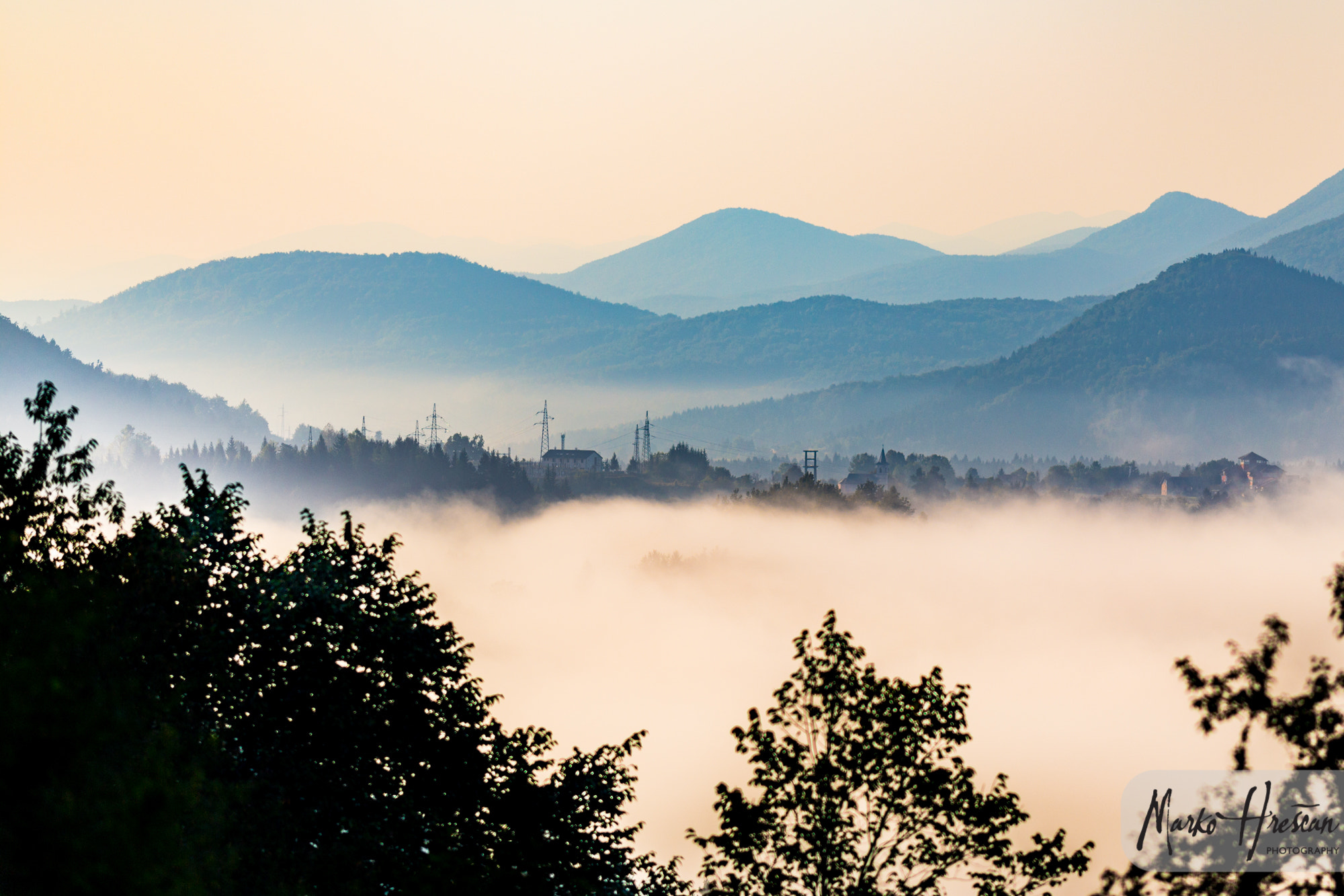 Canon EOS 6D + Canon EF 200mm F2.8L II USM sample photo. Town over fog photography