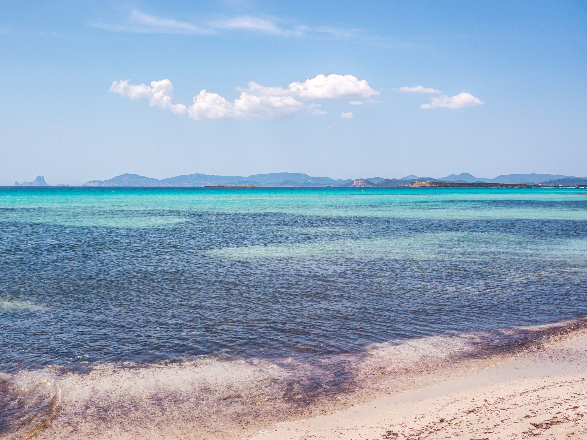 Panasonic Lumix DMC-G5 + Panasonic Lumix G 20mm F1.7 ASPH sample photo. View of ibiza from ses illetes beach photography