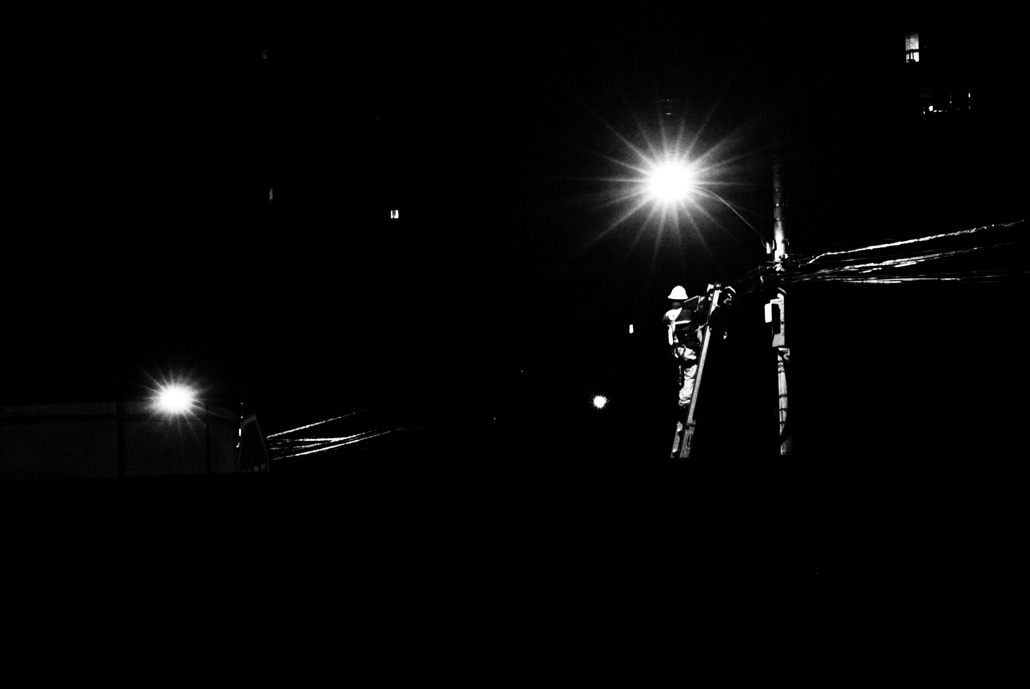 Sigma 24-70mm F2.8 EX DG Macro sample photo. Worker in black and white photography