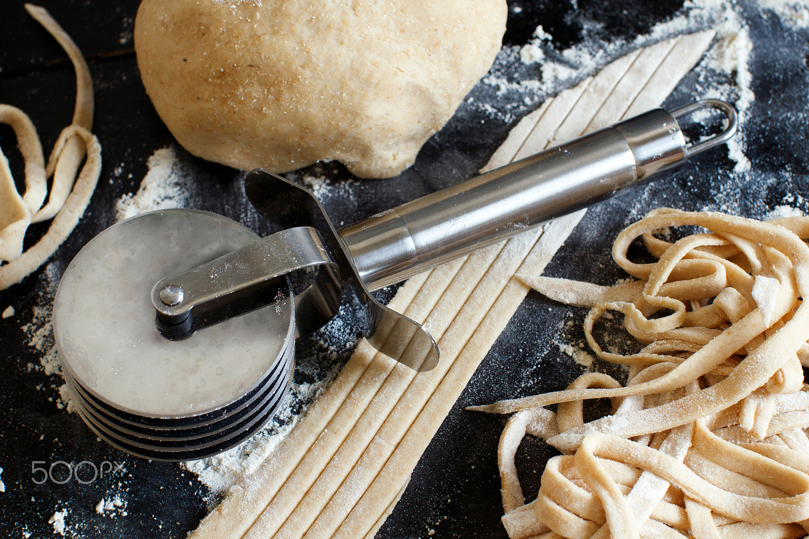 Canon EOS 650D (EOS Rebel T4i / EOS Kiss X6i) + Canon EF 50mm F1.2L USM sample photo. Making taglatelle with a pasta rolling cutter photography