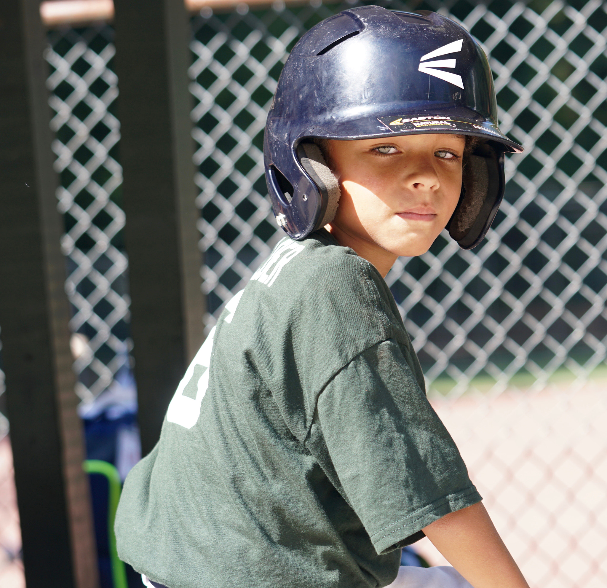 Sony a6300 + Sony FE 70-200mm F2.8 GM OSS sample photo. Boy in the dugout photography