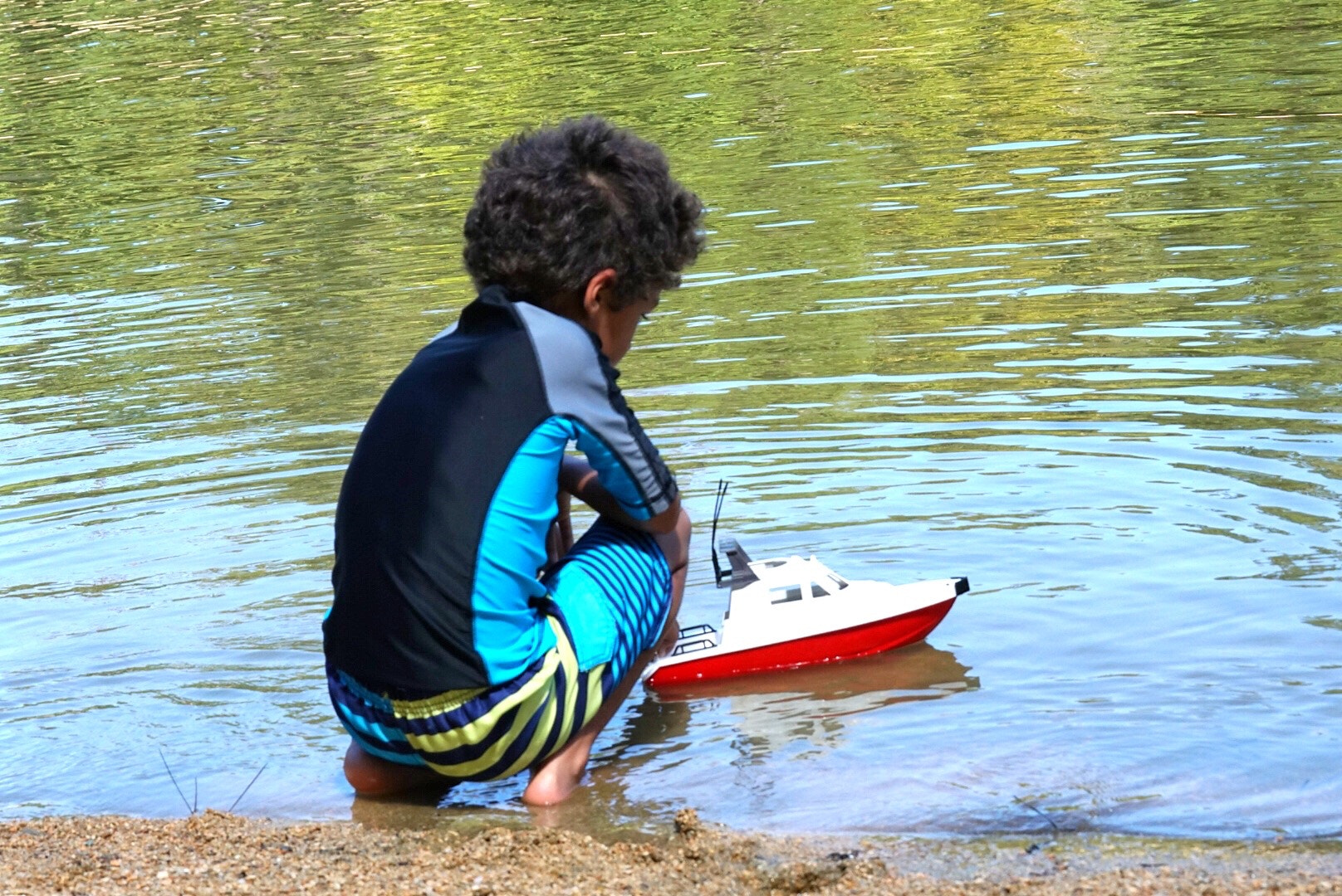 Sony a6300 + Sony FE 70-200mm F2.8 GM OSS sample photo. Boy with boat photography