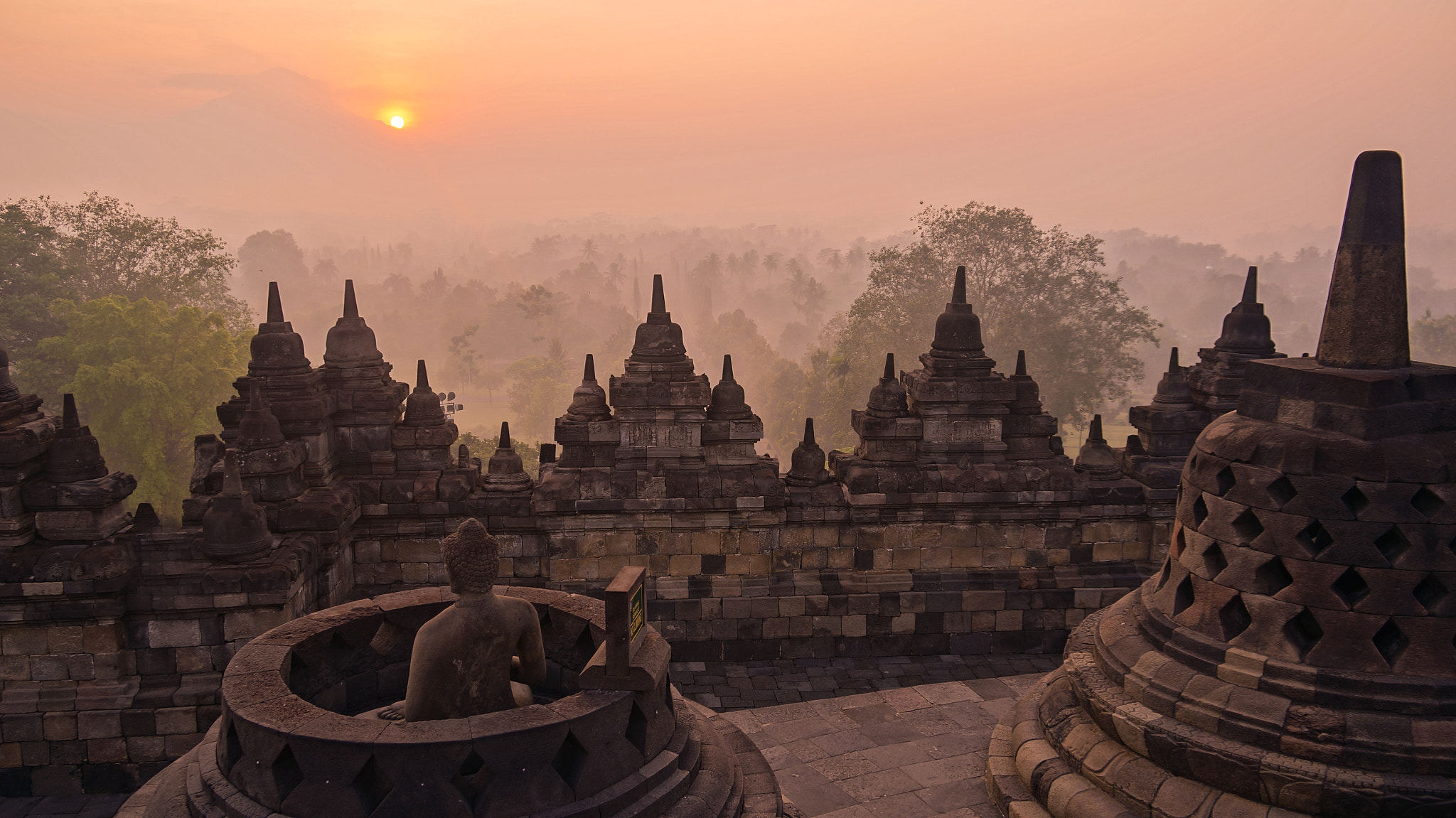 Sony E 18-200mm F3.5-6.3 OSS sample photo. Sunrise, buddha and an indonesian volcano photography