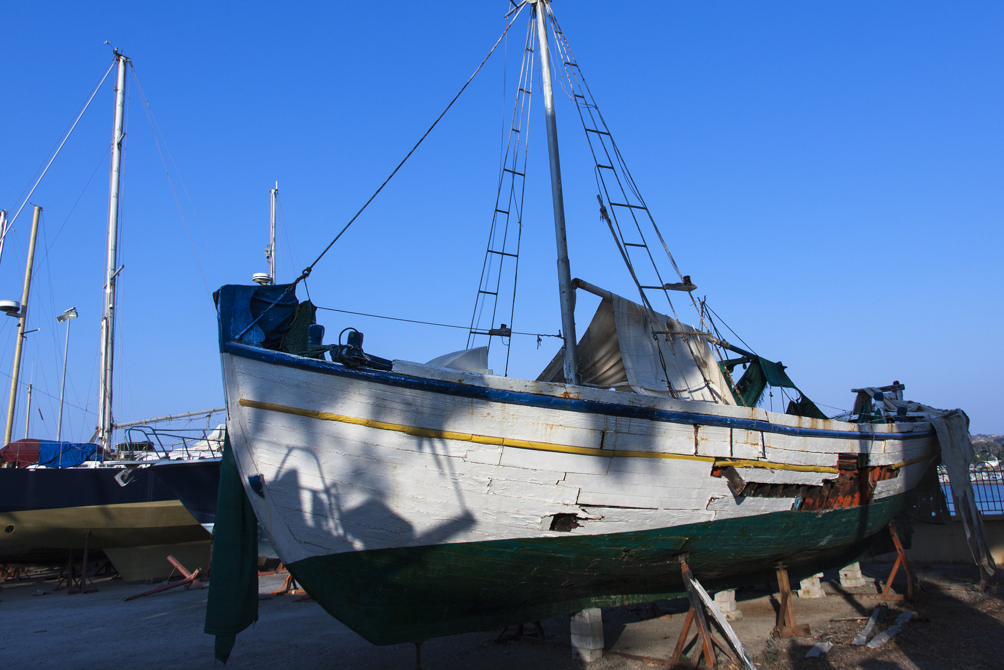 Canon EOS 50D + Canon EF-S 15-85mm F3.5-5.6 IS USM sample photo. Colorful boat in kos port photography