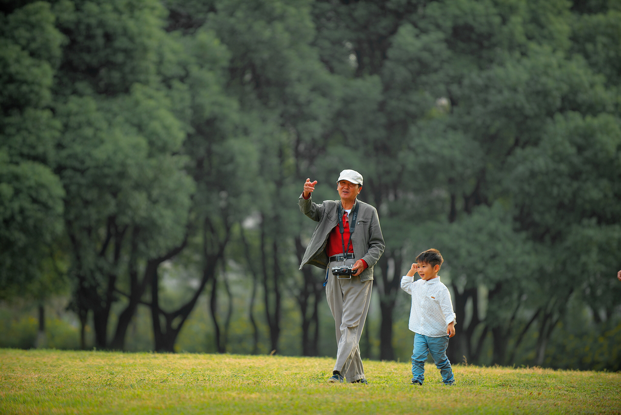 Nikon D800E sample photo. The grandpa is teaching his grandson how to fly the model plane. photography