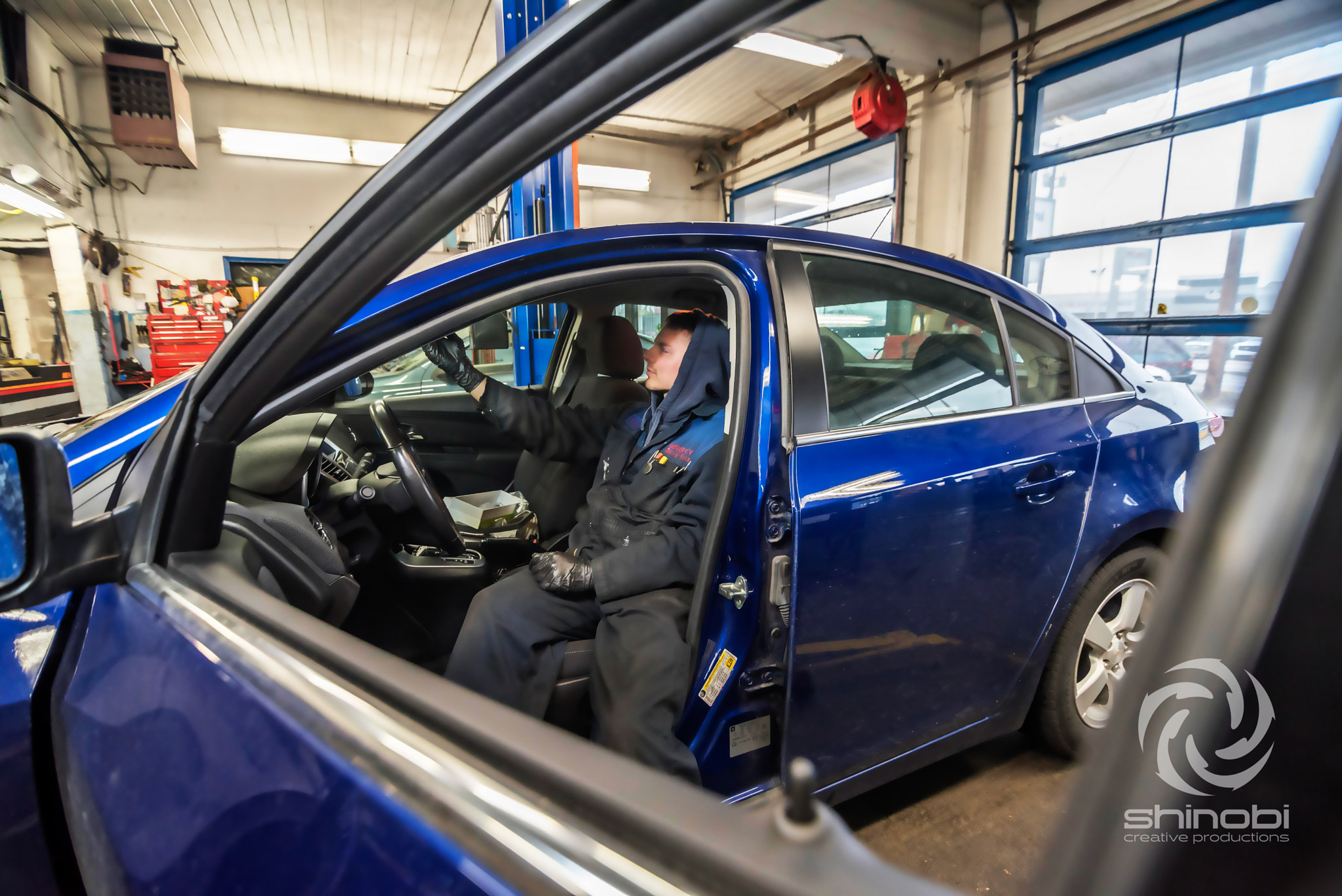 Tokina AT-X Pro 11-16mm F2.8 DX sample photo. Car repair through the window photography