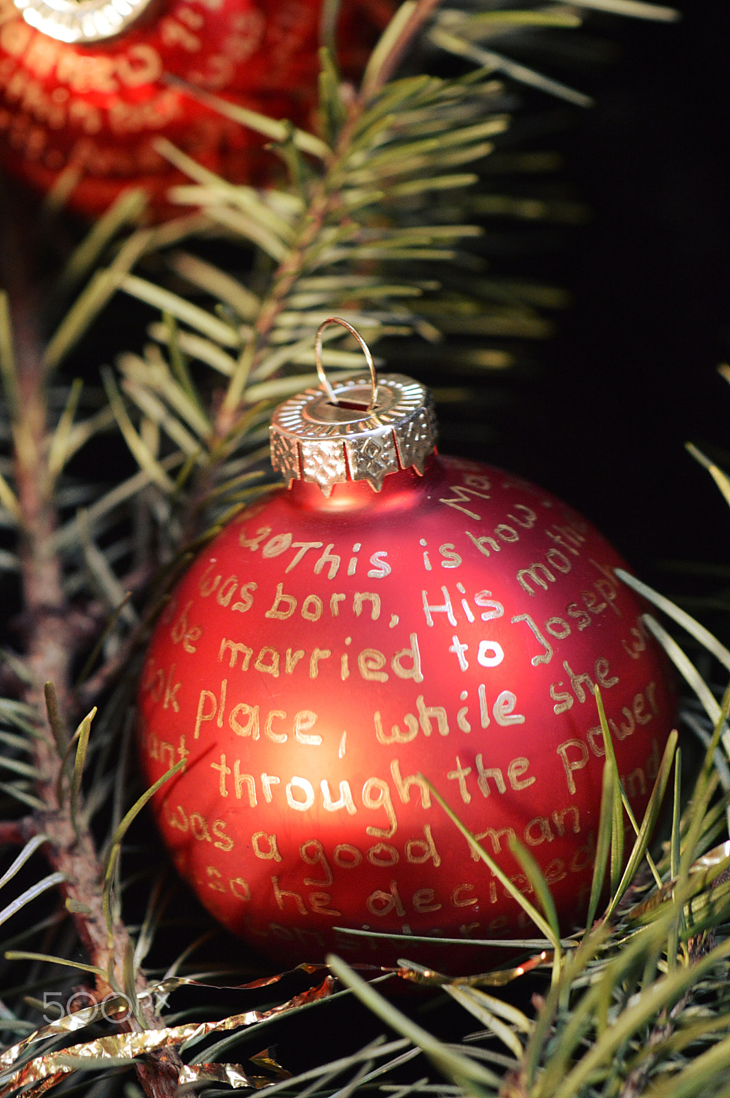 Nikon AF-S Micro-Nikkor 105mm F2.8G IF-ED VR sample photo. Nativity story on red christmas bulbs photography