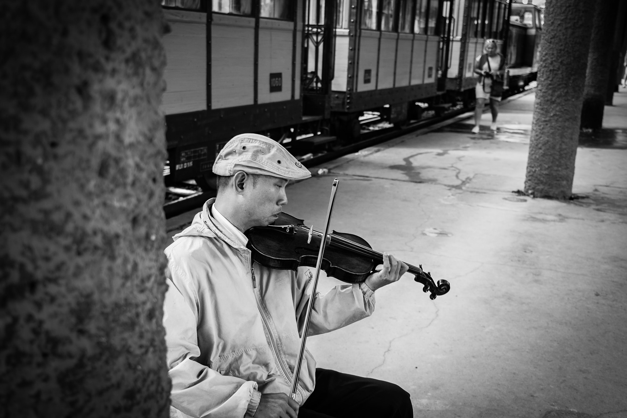 Canon EOS 50D + Canon EF-S 24mm F2.8 STM sample photo. Violinist at train station photography