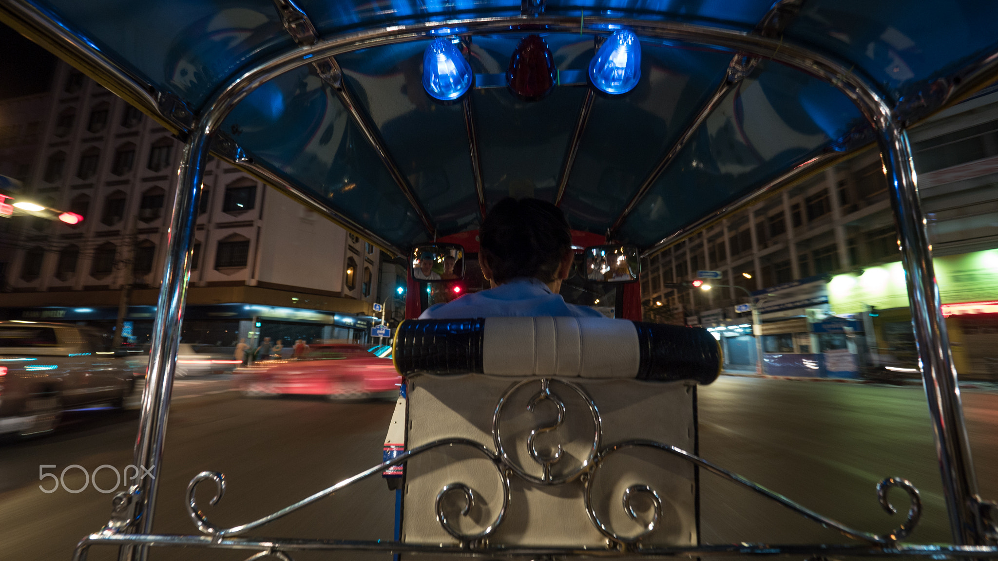 Driving tuktuk in night Bangkok, Thailand