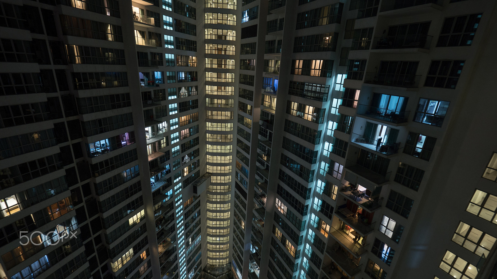 Panasonic Lumix DMC-GH4 + Olympus M.Zuiko Digital ED 7-14mm F2.8 PRO sample photo. Window lights in multistorey house at night, kuala lumpur photography